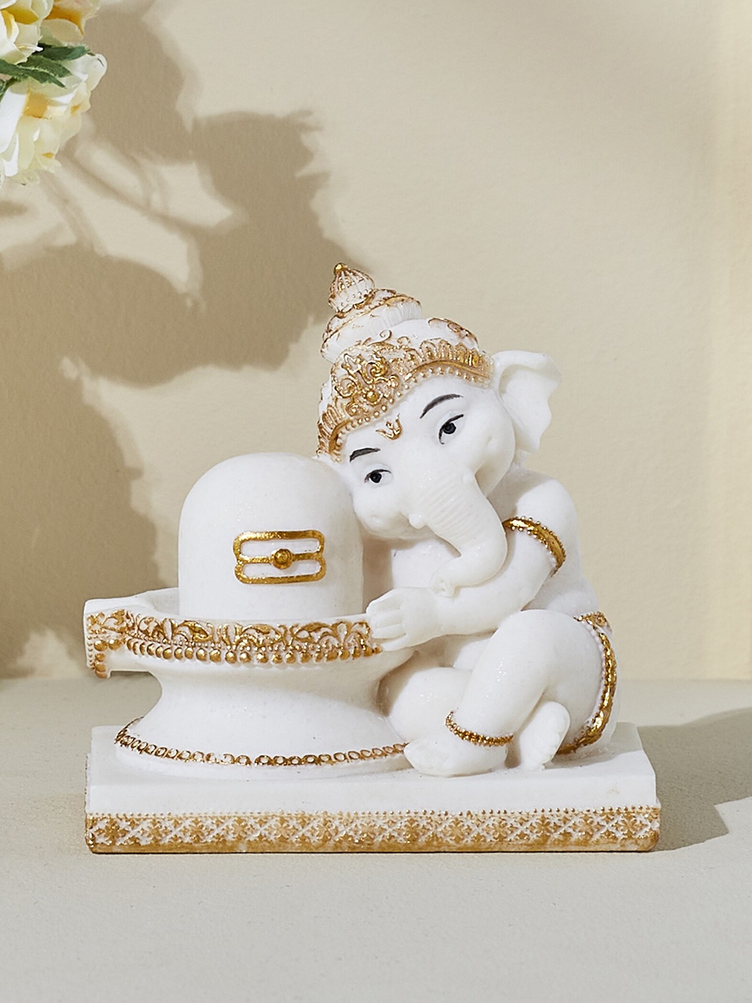 

Home Centre White & Gold-Toned Ganesha With Linga Showpiece