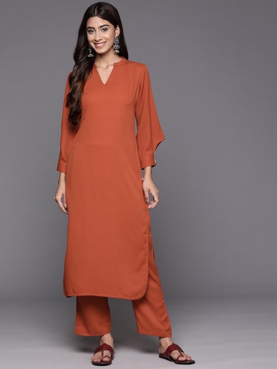 

Varanga Rust Mandarin Collar Cuffed Sleeves Straight Kurta with Trousers