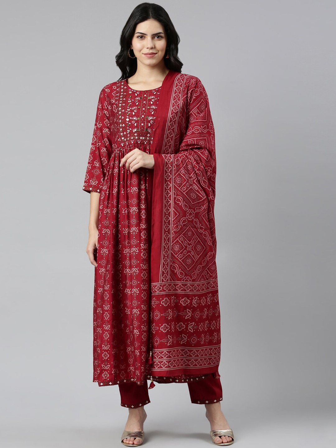 

Neerus Bandhani Printed Mirror Work Kurta & Trousers With Dupatta, Maroon