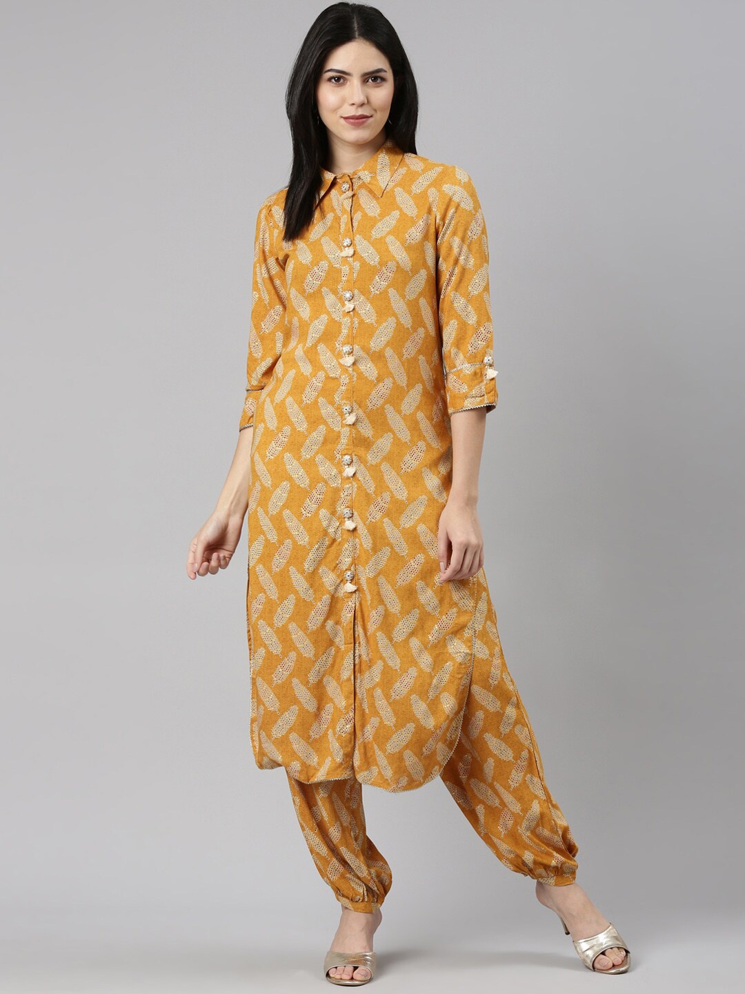 

Neerus Ethnic Motifs Printed Shirt Collar Three-Quarter Sleeve Gotta Patti Kurta Sets, Mustard