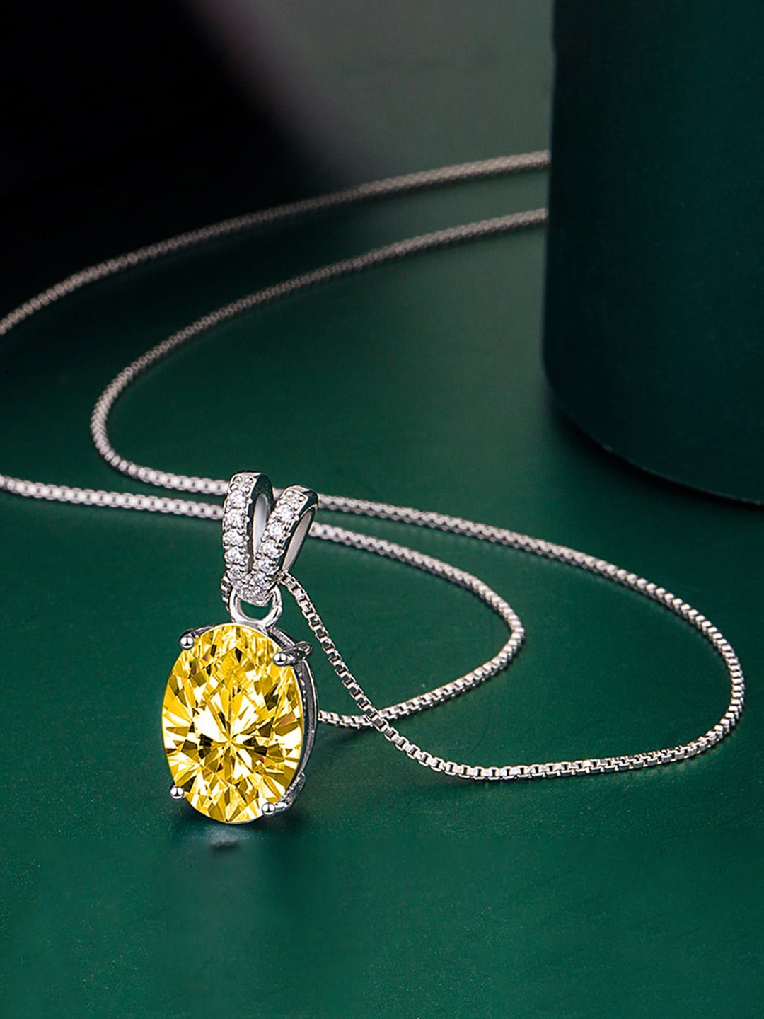 

Designs & You Silver-Plated Cubic Zirconia Studded Oval Shaped Pendant