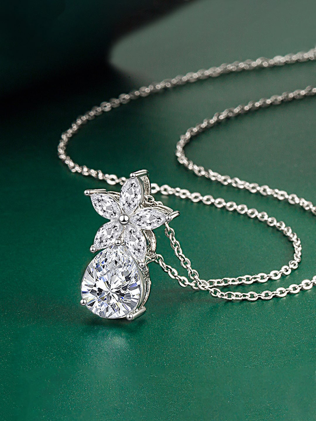 

Designs & You Silver-Plated Cubic Zirconia Studded Teardrop Shaped Pendant With Chain