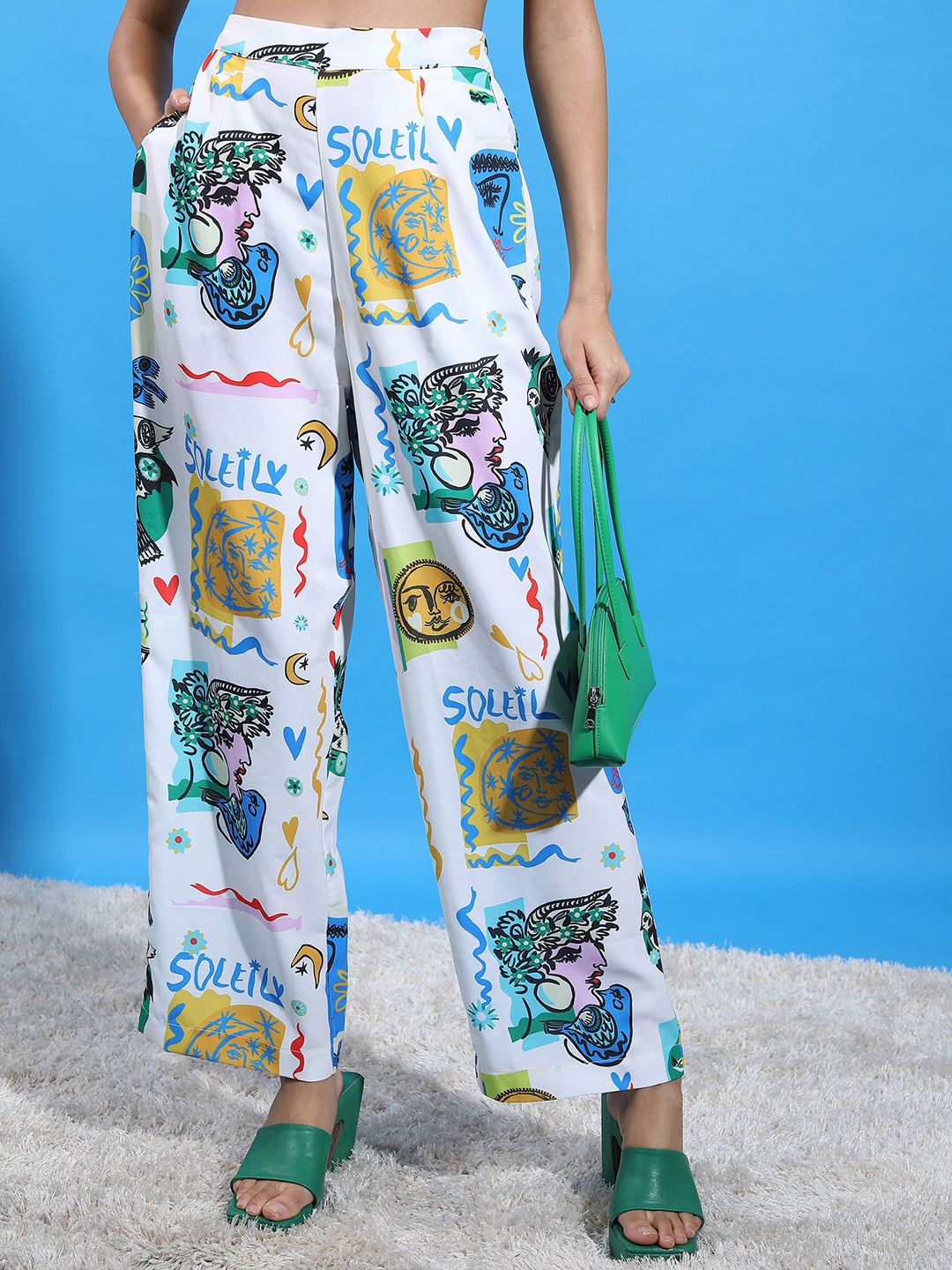 

Tokyo Talkies Women Off White Graphic Printed Flared Trousers