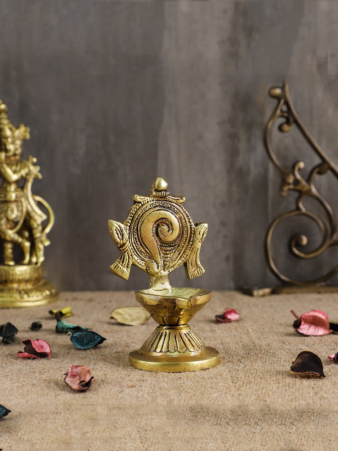 

Two Moustaches Gold-Toned Shankh Chakra Brass Diya Pair