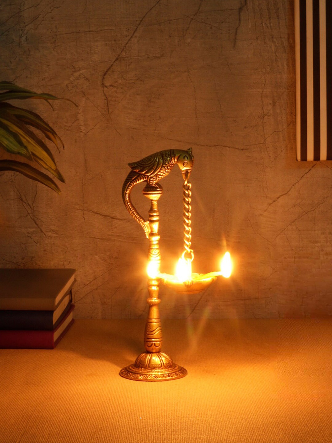 

Two Moustaches Gold-Toned Parrot Design Hanging Diya Pair