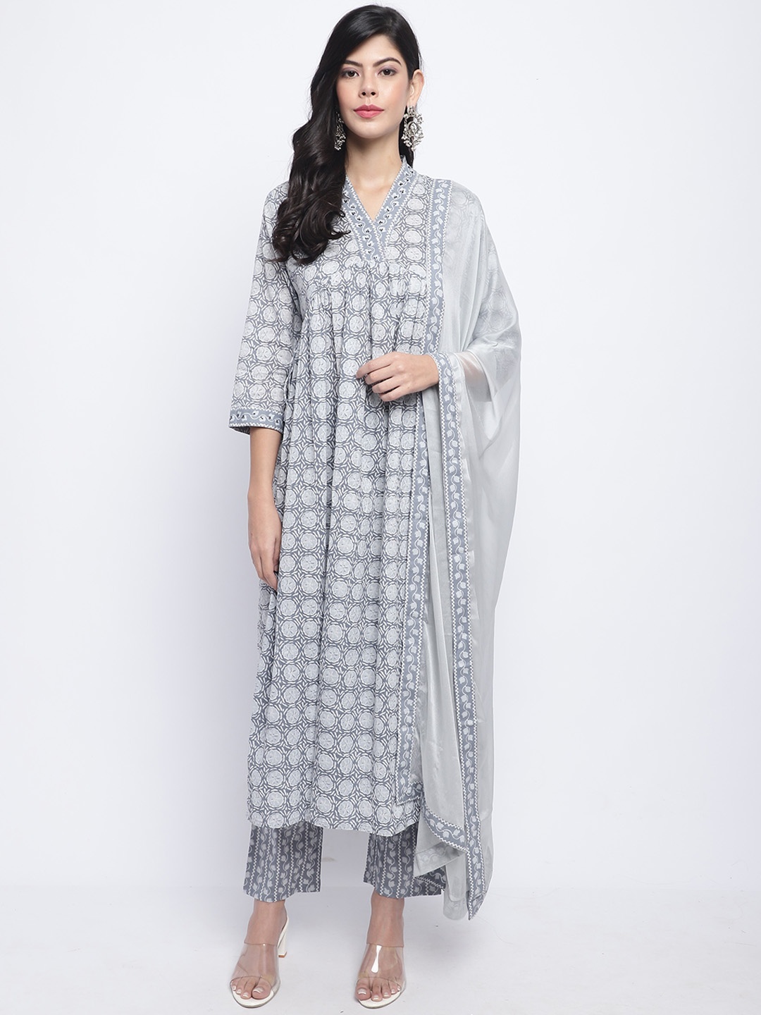 

Rajnandini Women Grey Floral Embroidered Regular Beads and Stones Pure Cotton Kurti with Trousers & With