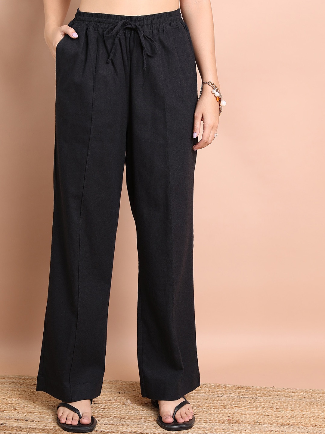 

Tokyo Talkies Women Black Flared Pleated Trousers