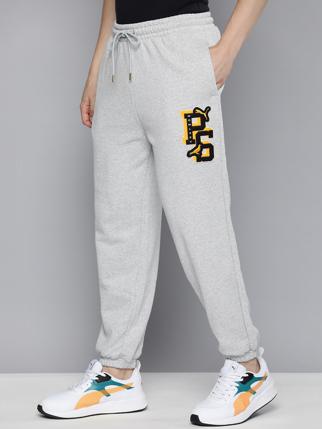 

Puma Men Staple Applique Detail Relaxed Fit Mid-Rise Pure Cotton Joggers, Grey melange