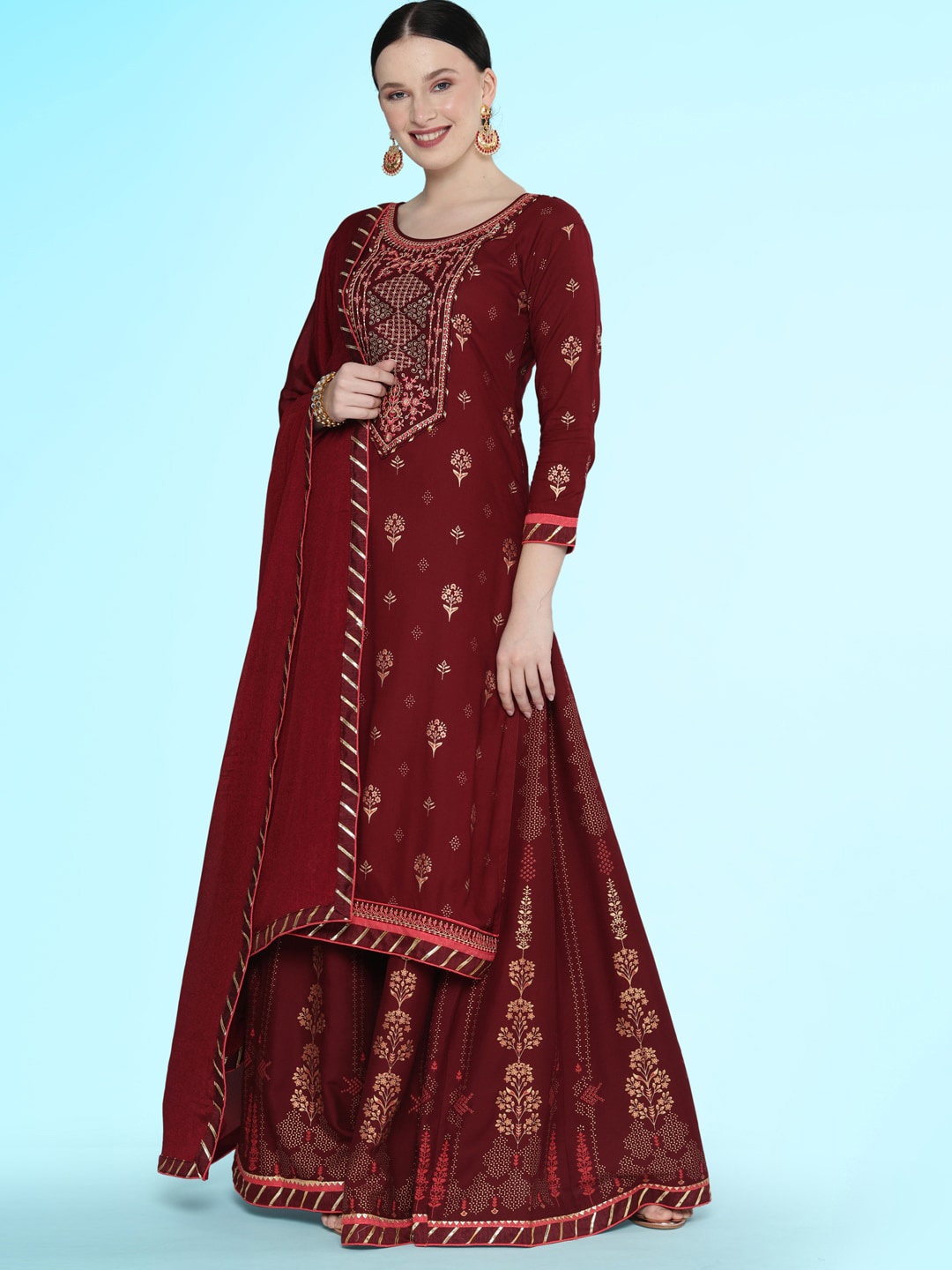 

Sangria Maroon Ethnic Motifs Printed Sequined Foil Straight Kurta With Skirt & Dupatta