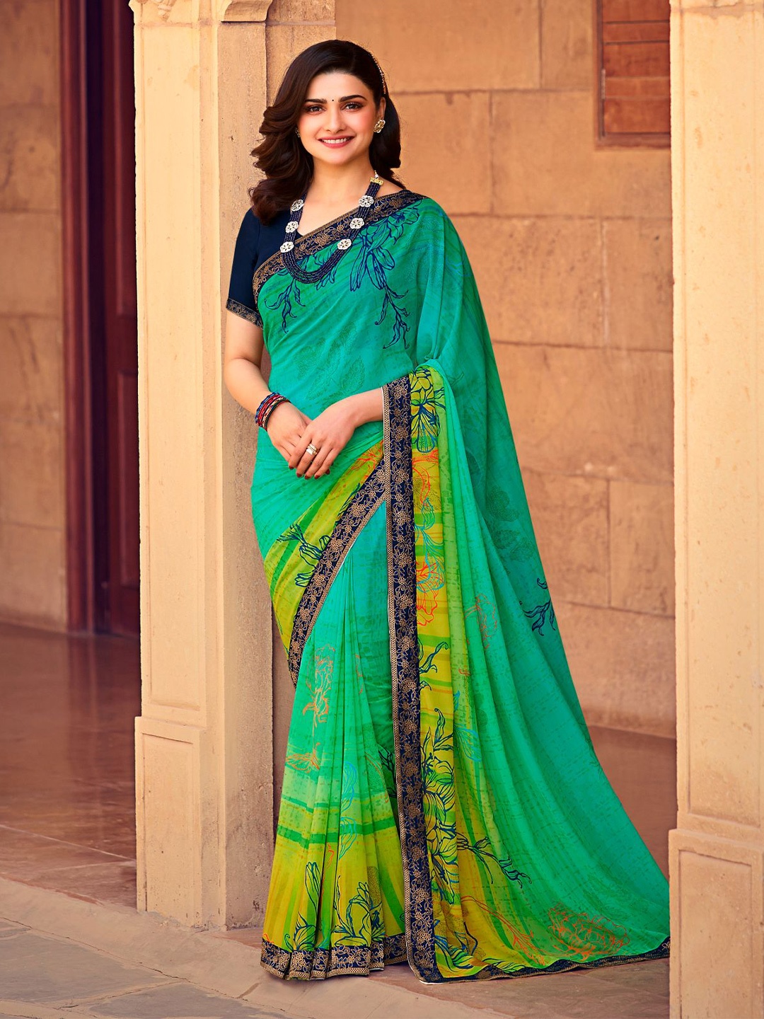 

VAIRAGEE Floral Printed Embellished Poly Georgette Saree, Green