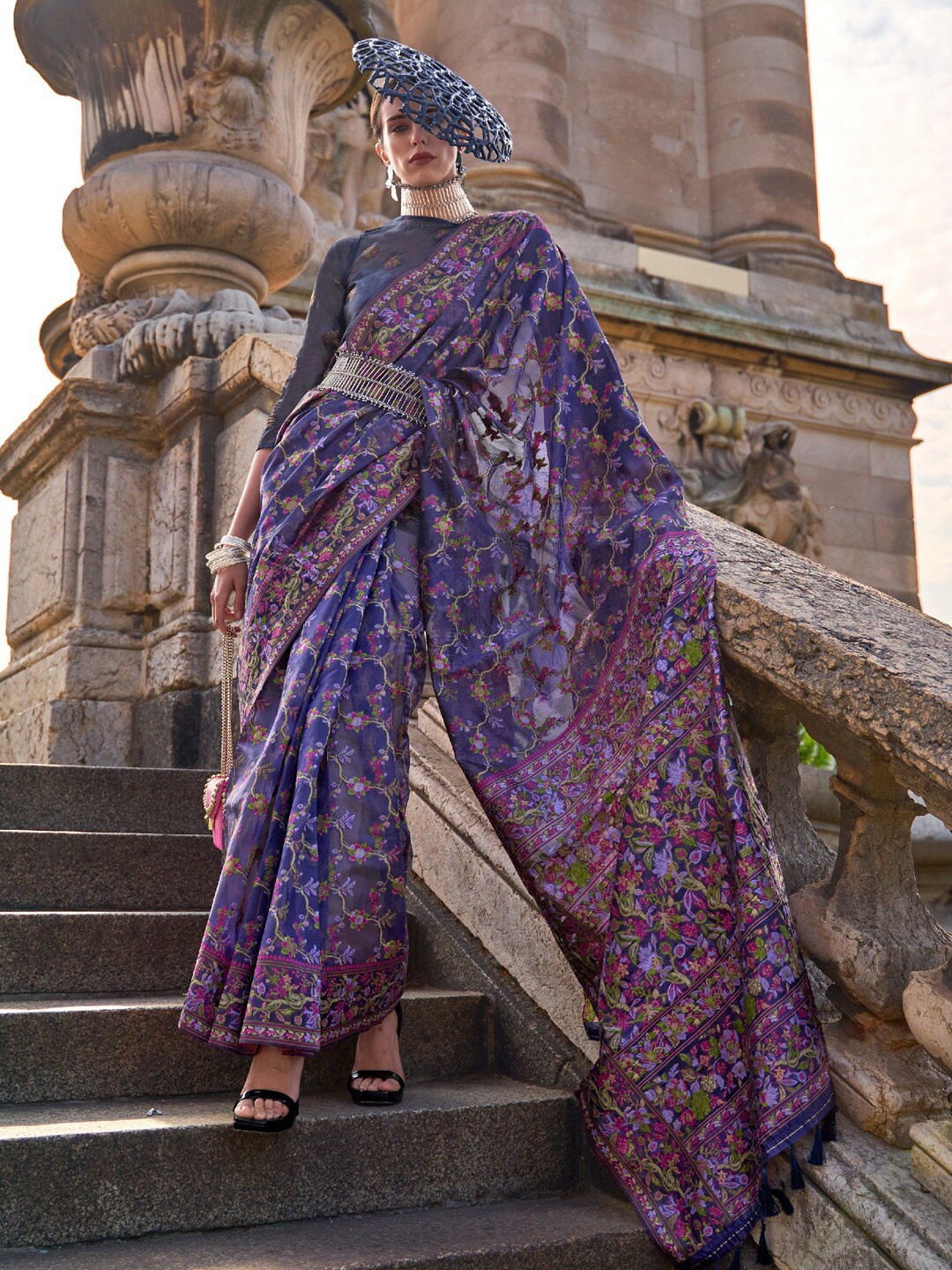 

Mitera Blue & Purple Floral Woven Design Zari Organza Banarasi Saree