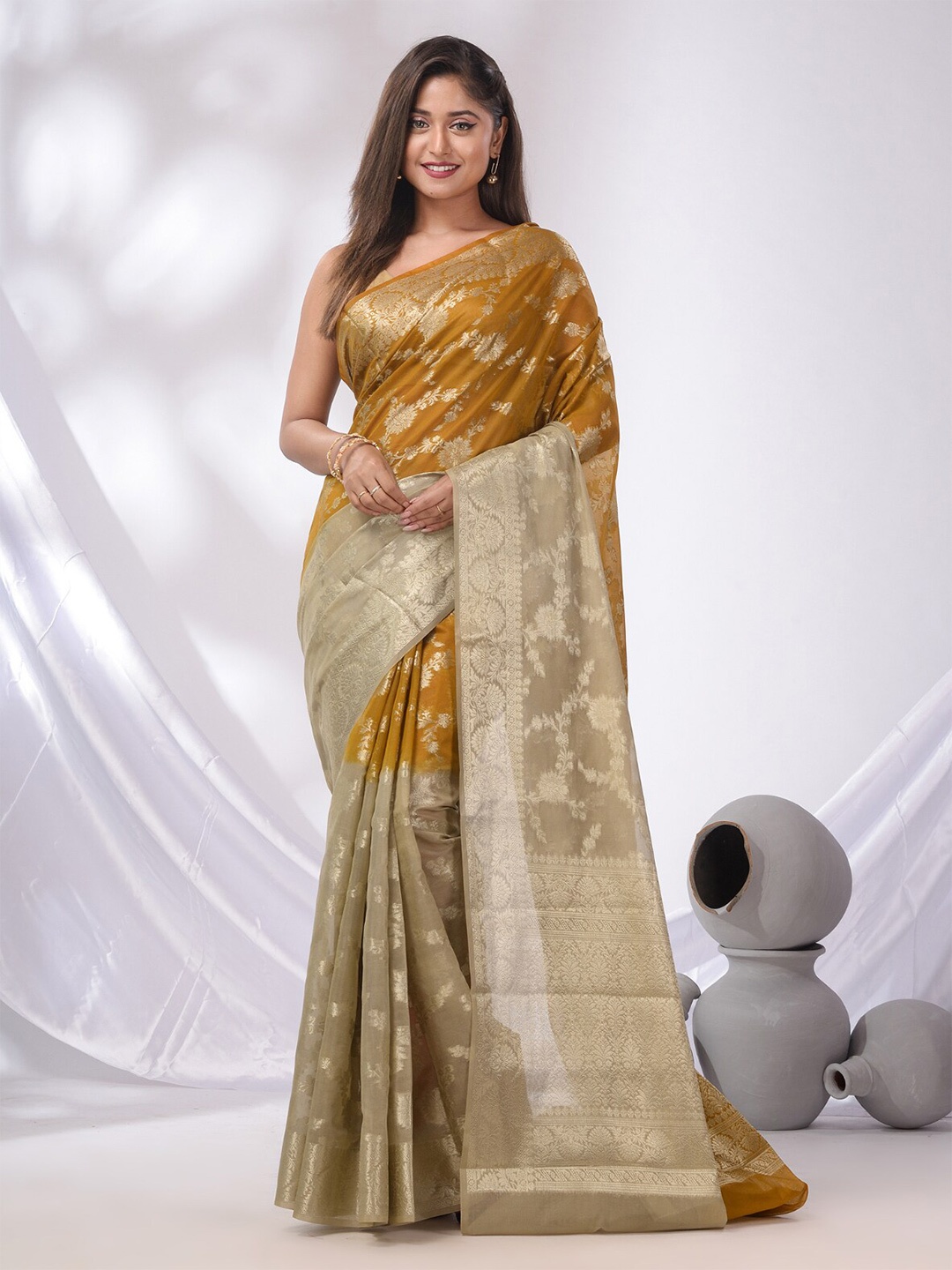 

Charukriti Woven Design Zari Pure Georgette Saree, Yellow