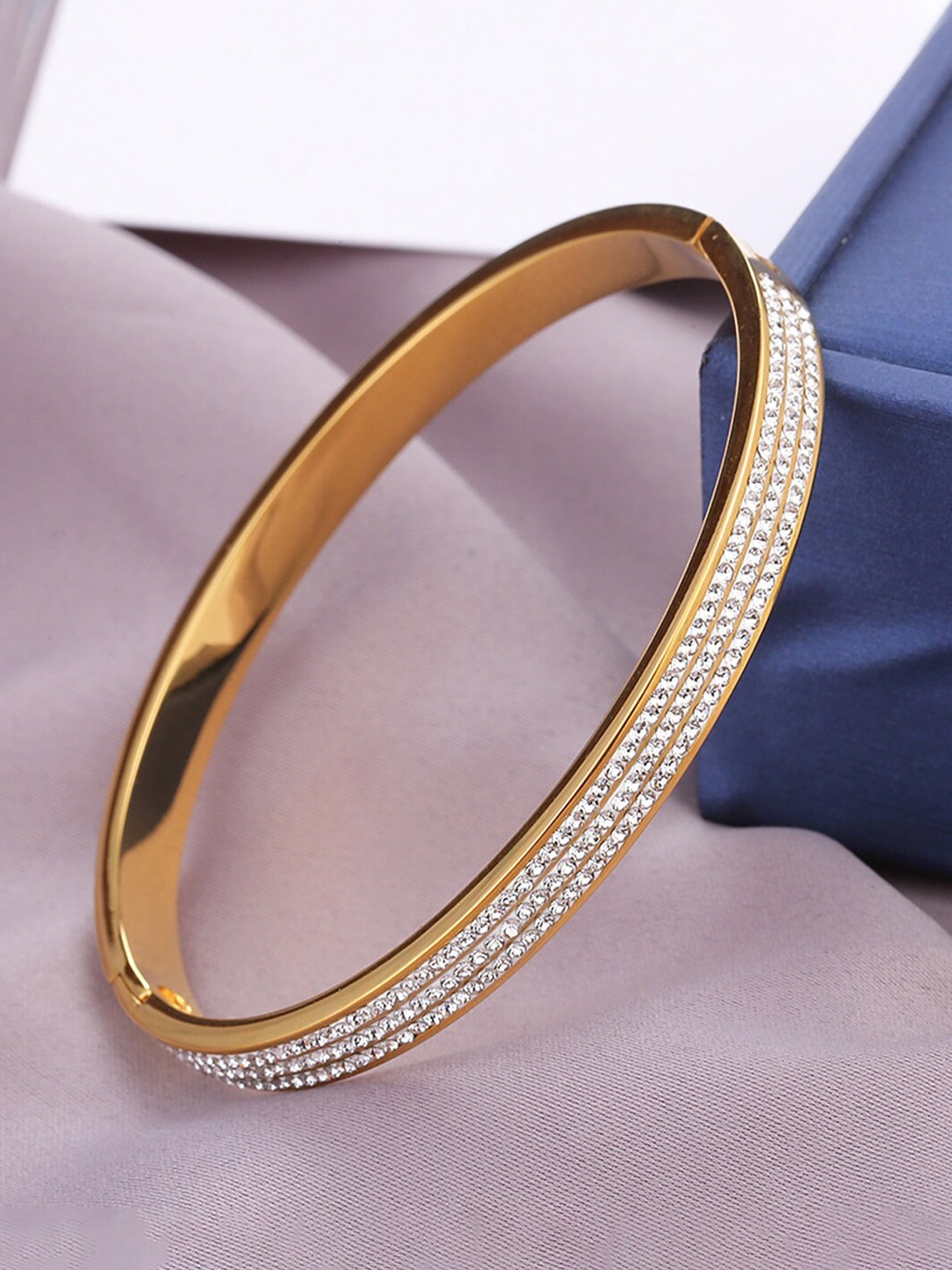 

Designs & You Stainless Steel Gold-Plated American Diamond Studded Bangle-Style Bracelet