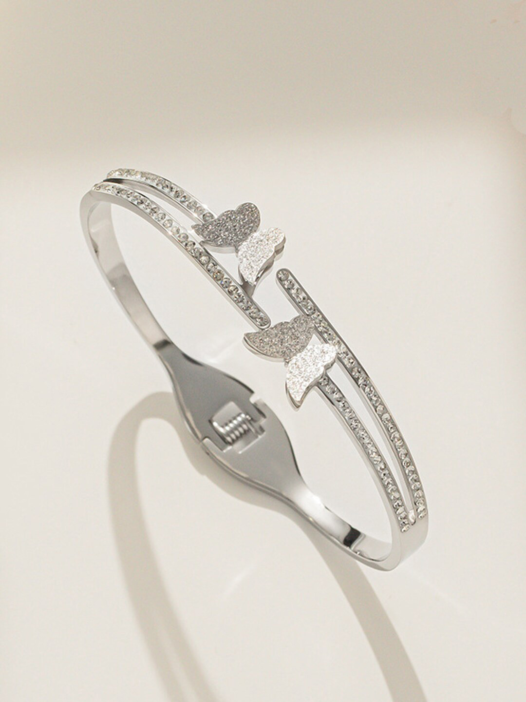 

Designs & You Silver-Plated American Diamond Studded Bangle-Style Bracelet