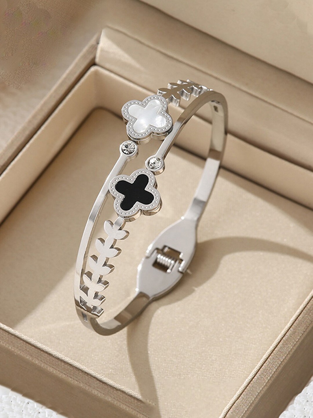 

Designs & You Silver-Plated Two Clover Leaf Detail Bangle-Style Bracelet