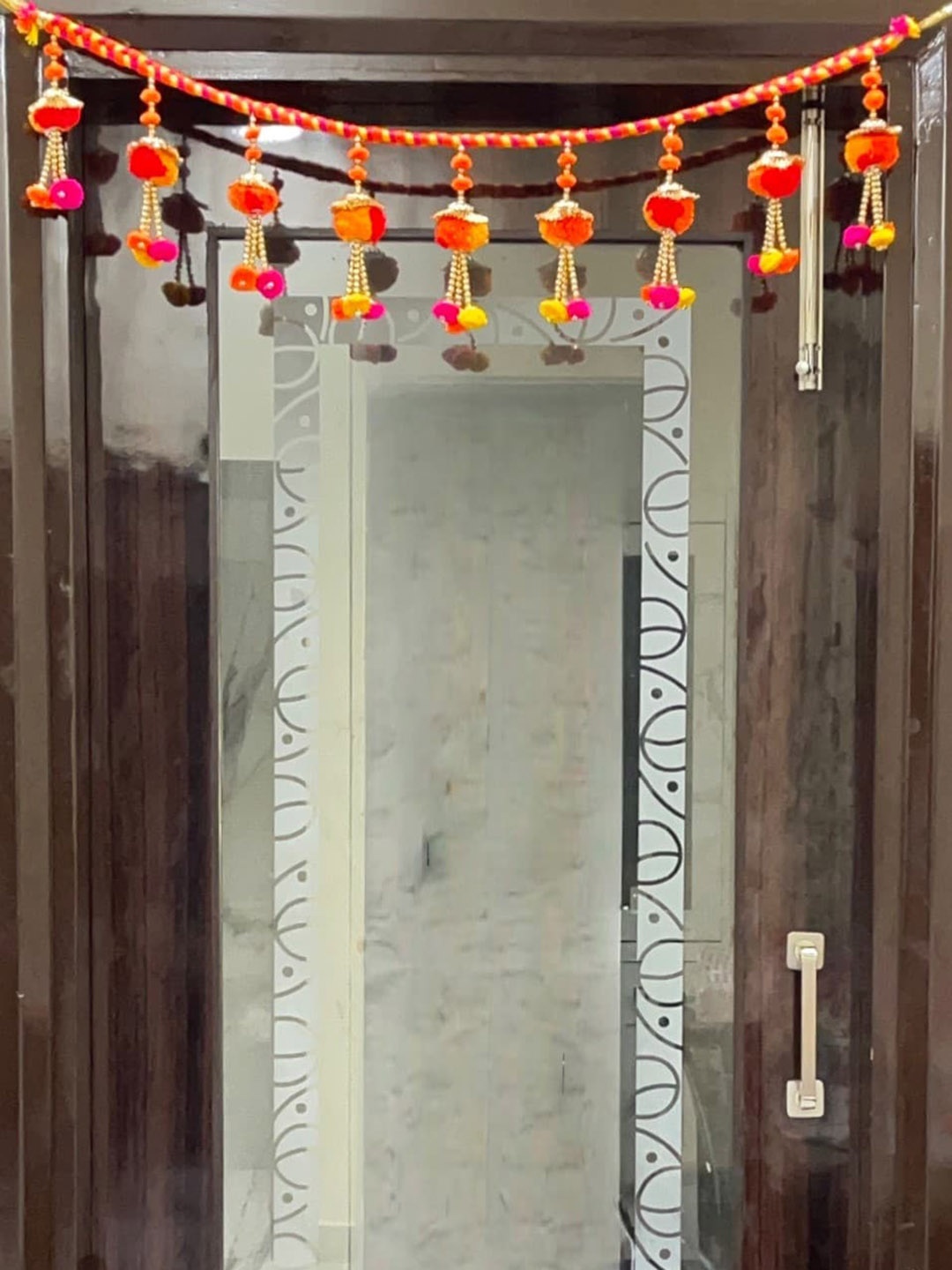 

Akaar Orange & Yellow Artificial Floral Hanging Toran