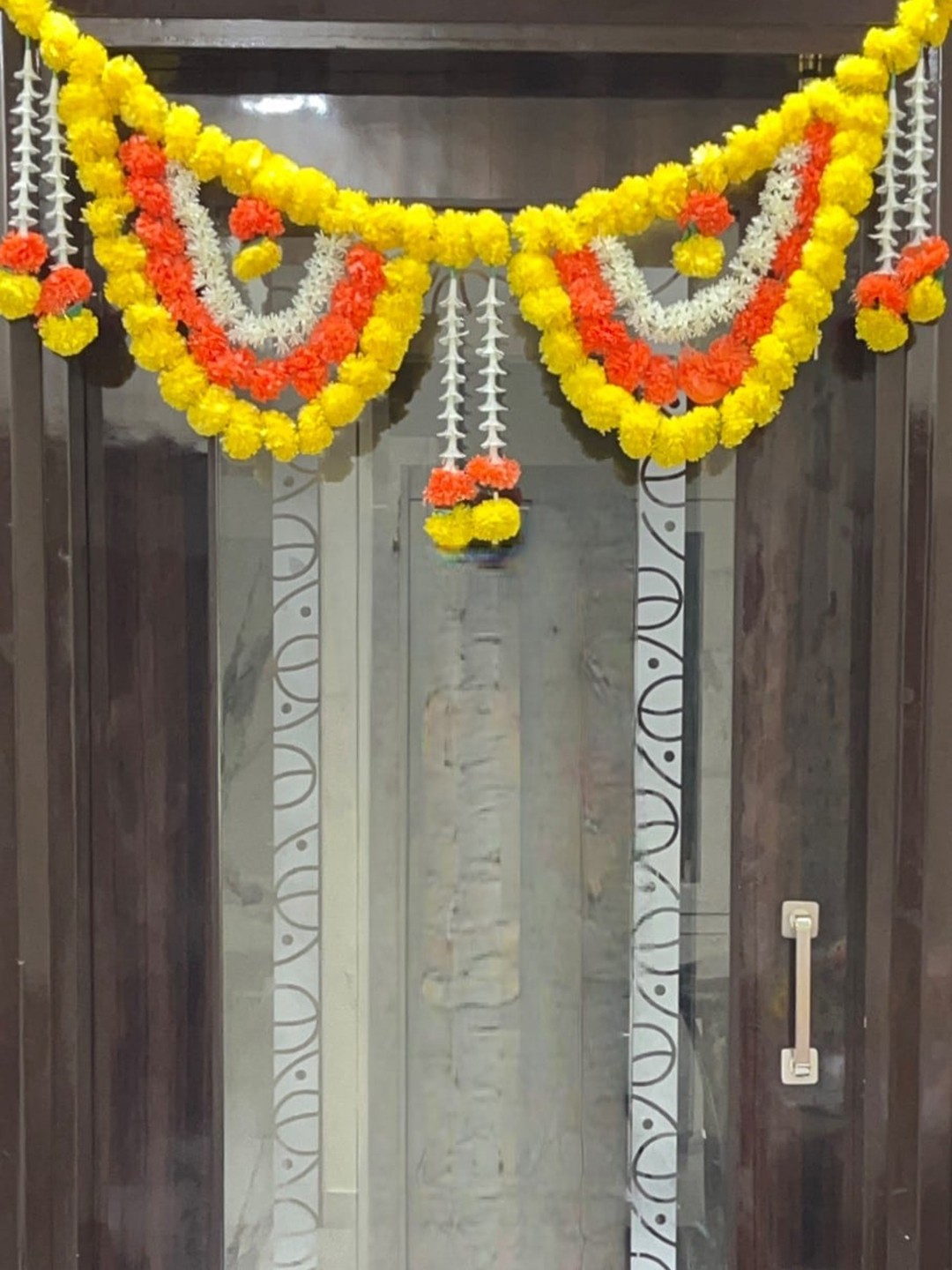 

Akaar Orange & Yellow Artificial Floral Hanging Toran