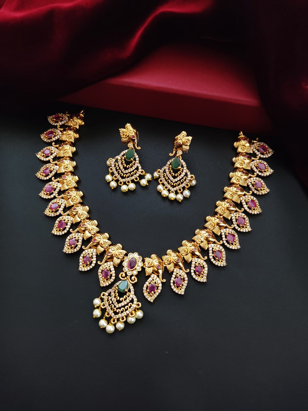 

Pihtara Jewels Gold Plated Ganesh Design Stone Studded Jewellery Set