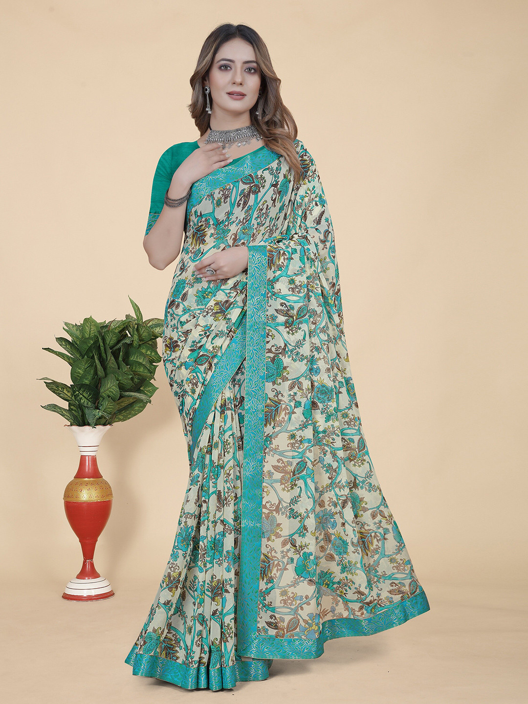 

KALINI Floral Printed Zari Pure Georgette Saree, Turquoise blue