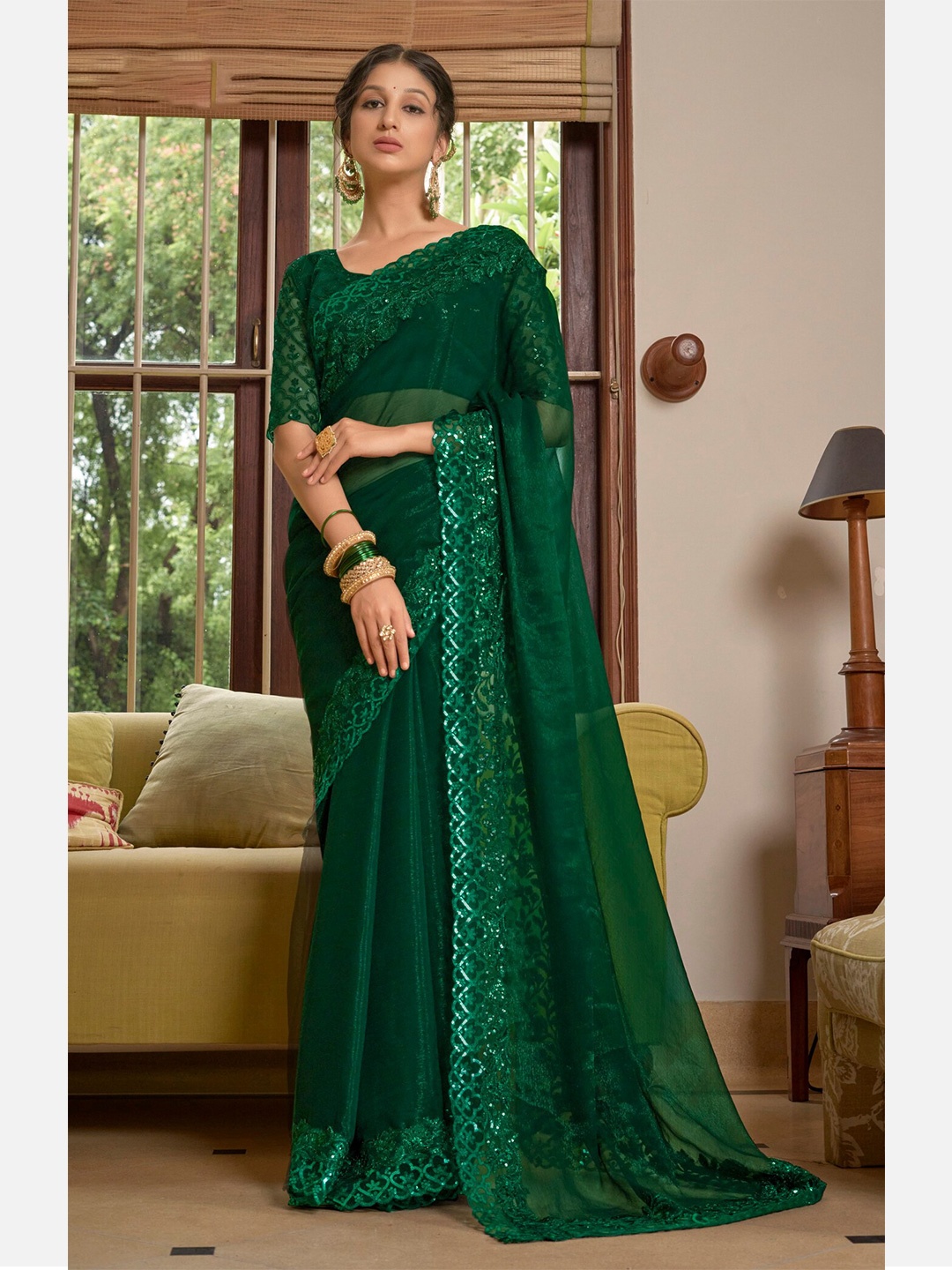 

Mitera Green Embellished Border Sequinned Pure Chiffon Saree