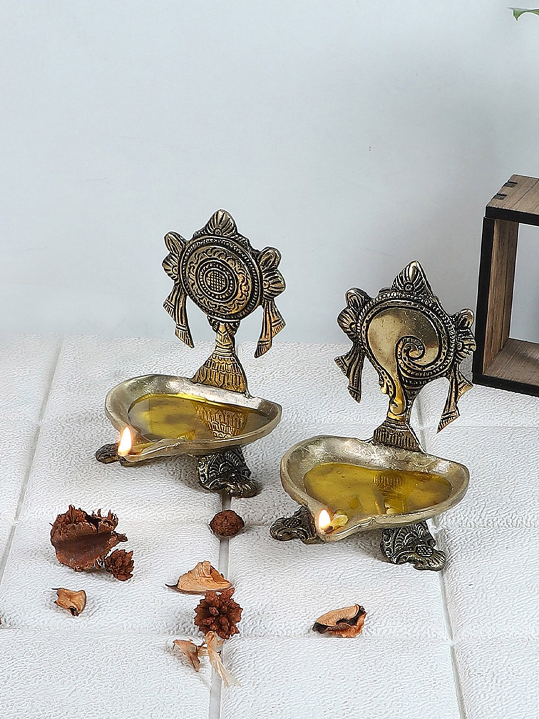 

Two Moustaches Set Of 2 Shankh Chakra Diyas, Metallic