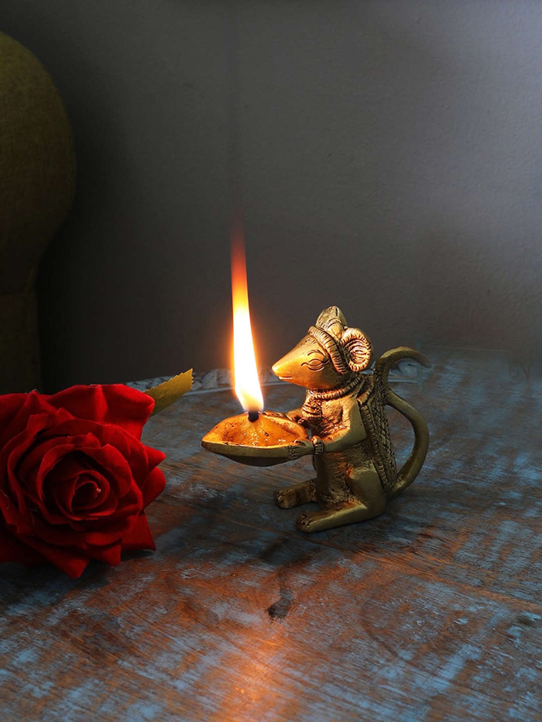 

Two Moustaches Gold Toned Brass Lord Ganesha's Mouse Holding Oil Lamp Diya