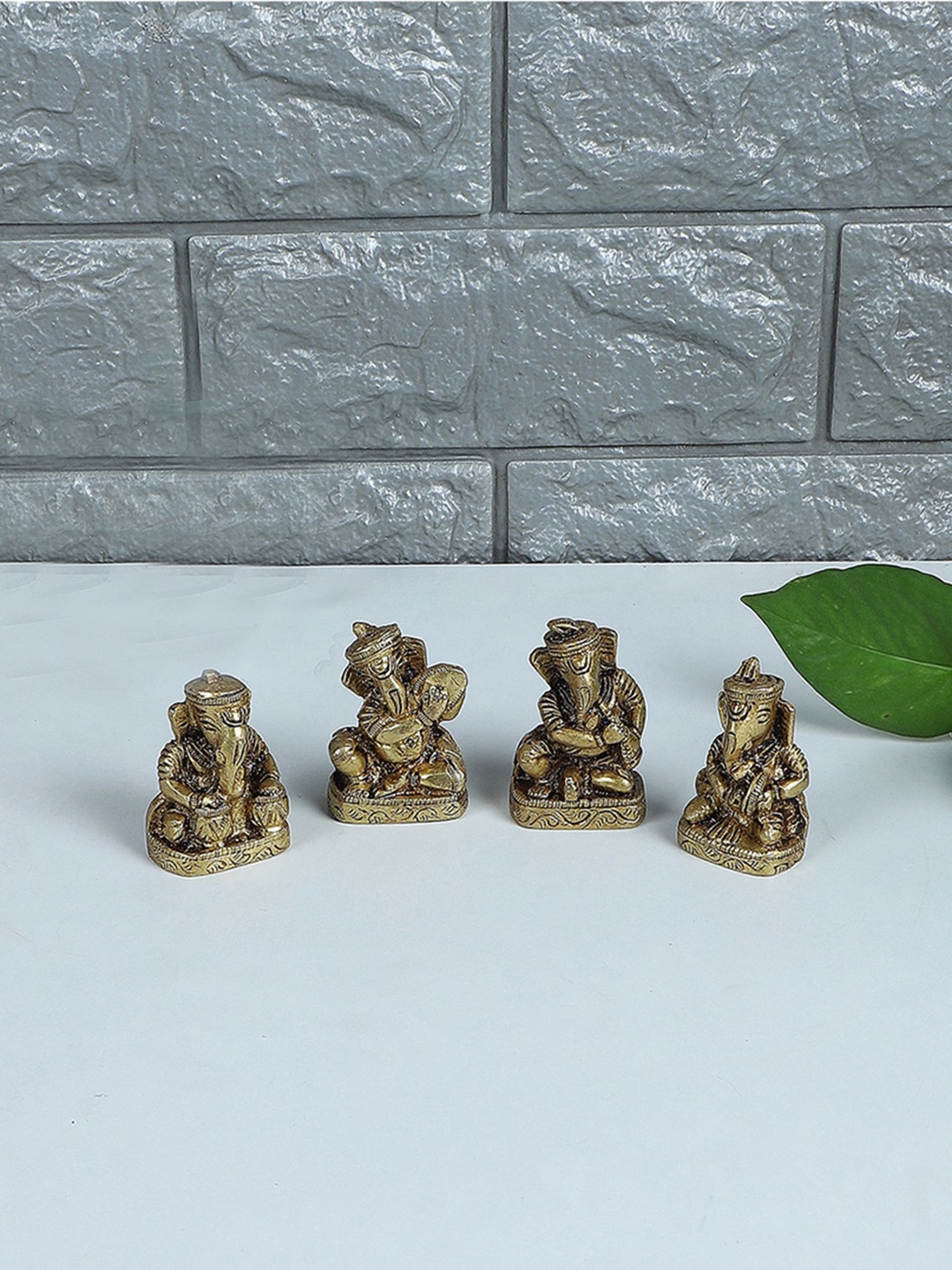 

Two Moustaches Gold-Toned 4 Pieces Musical Ganesha Showpieces
