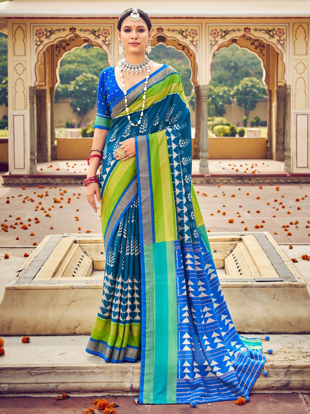 

Saree mall Teal & Green Ethnic Motifs Printed Zari Ikat Sarees