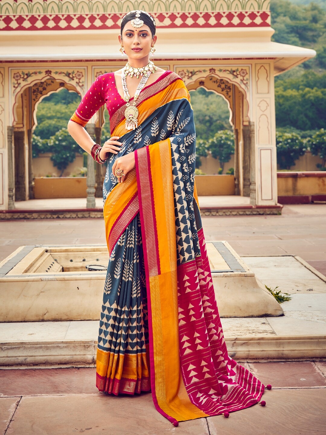 

Saree mall Blue & Yellow Floral Printed Zari Ikat Sarees