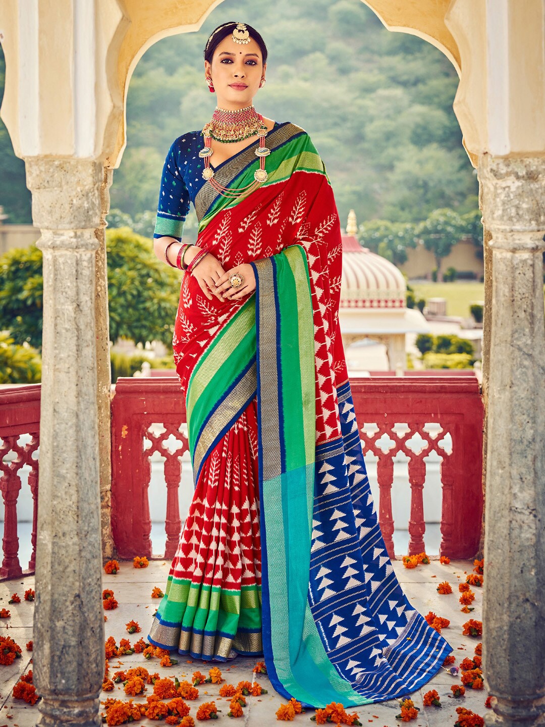 

Saree mall Red & Blue Ethnic Motifs Printed Zari Ikat Sarees