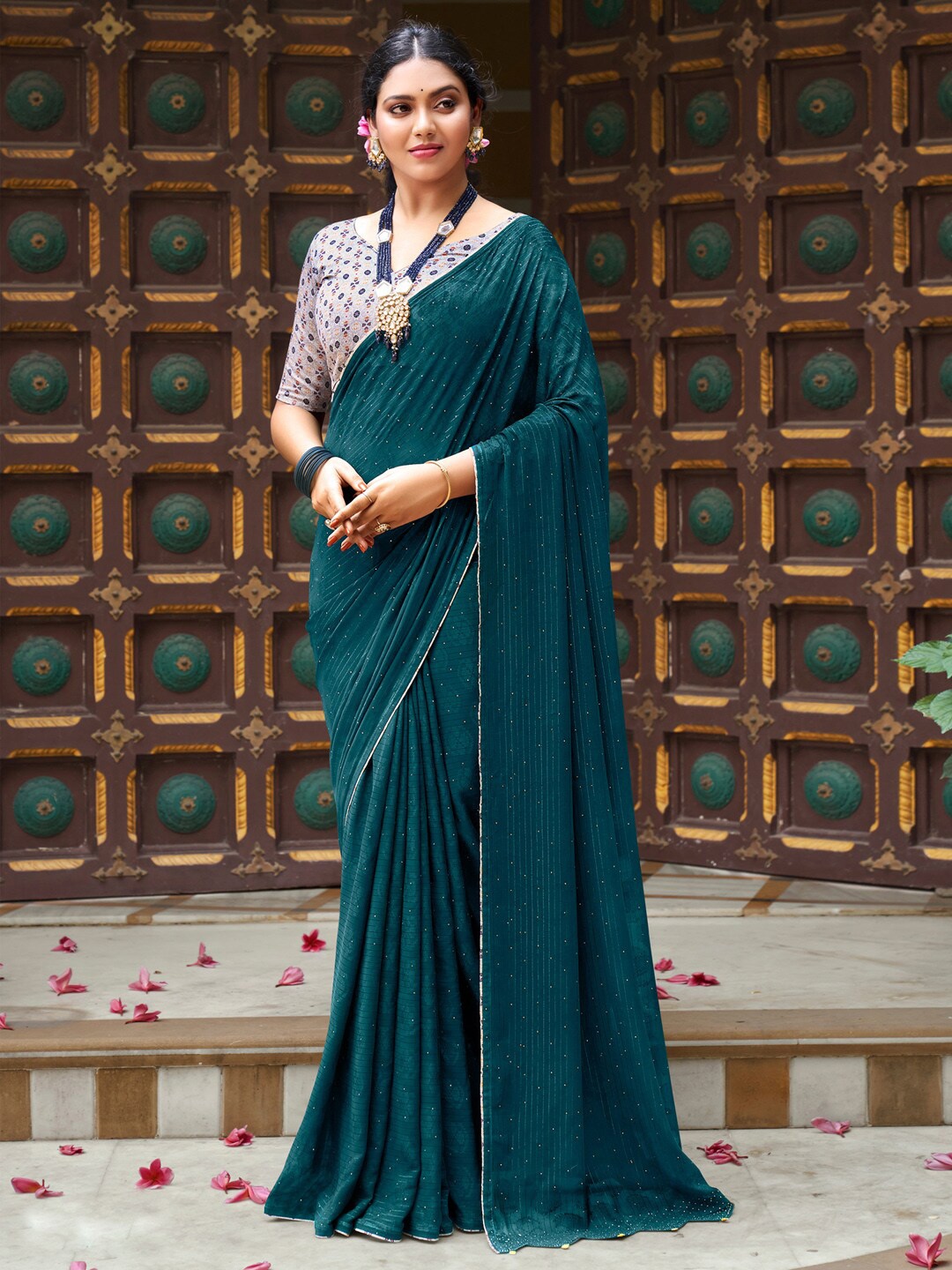 

Saree mall Teal & White Embellished Beads and Stones Pure Georgette Sarees