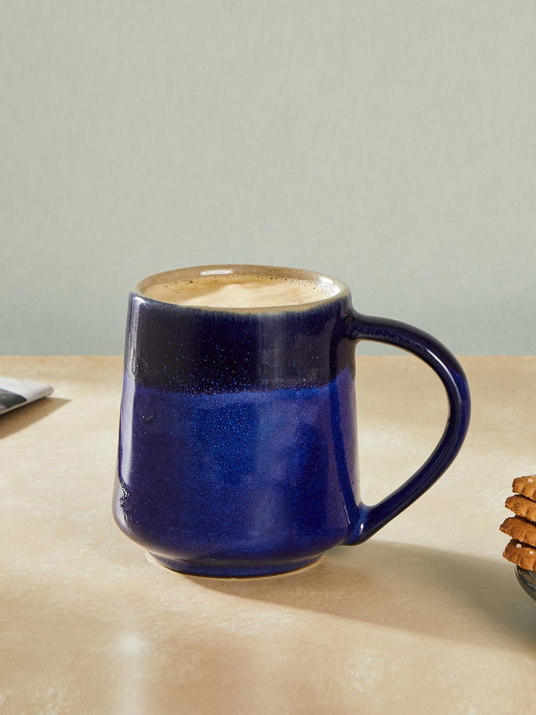 

Fabindia Blue & Navy Blue Textured Ceramic Glossy Mug - 280 ML