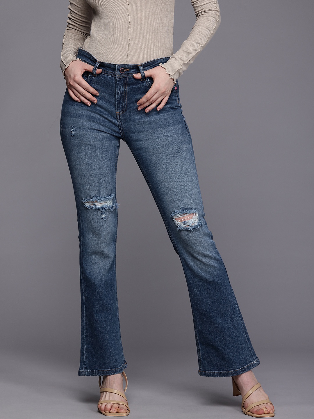 

Allen Solly Woman Flared Mildly Distressed Heavy Fade Stretchable Jeans, Blue