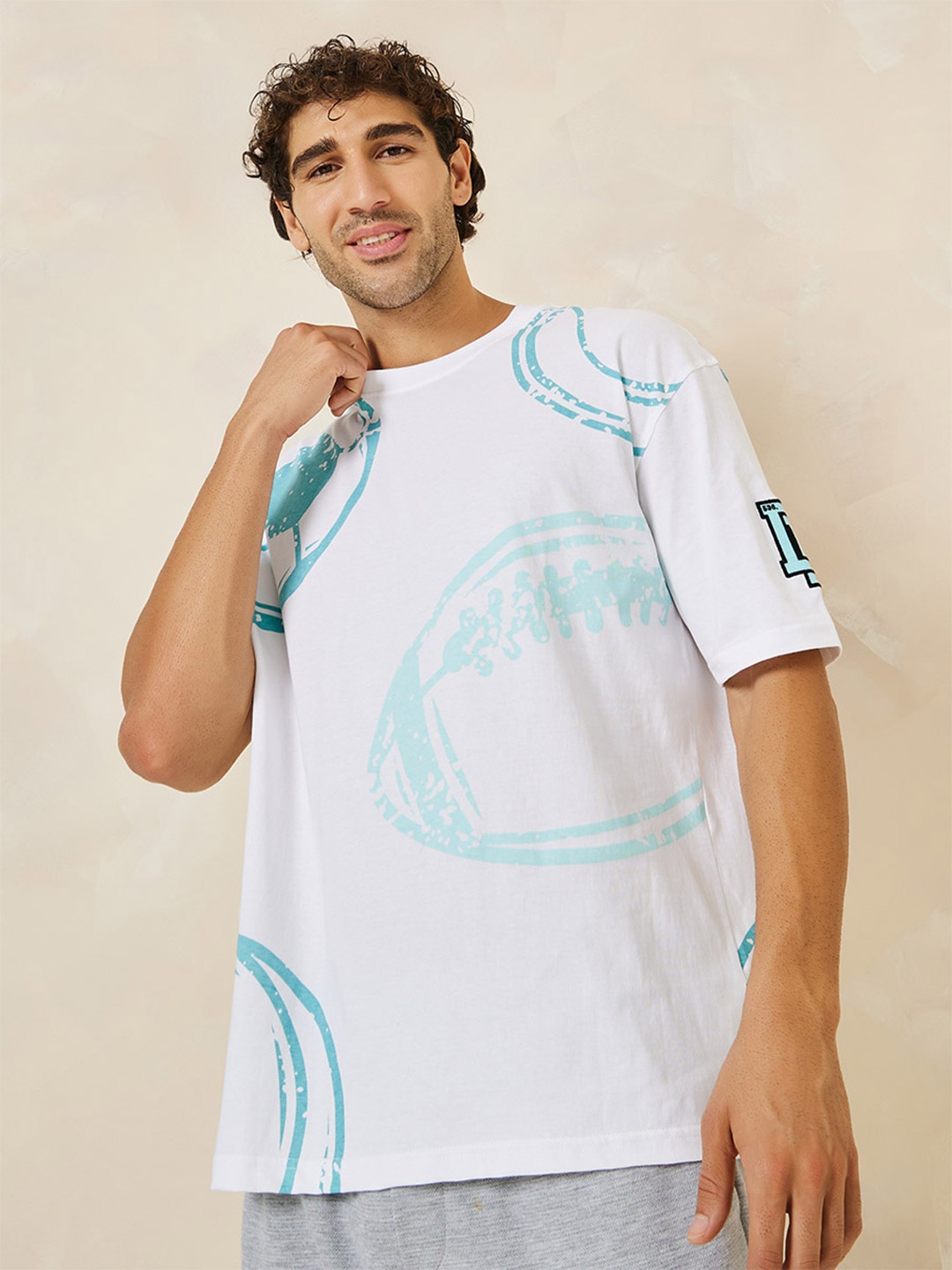 

Styli Men All Over Print Compact Jersey Oversized Badge T-Shirt, White