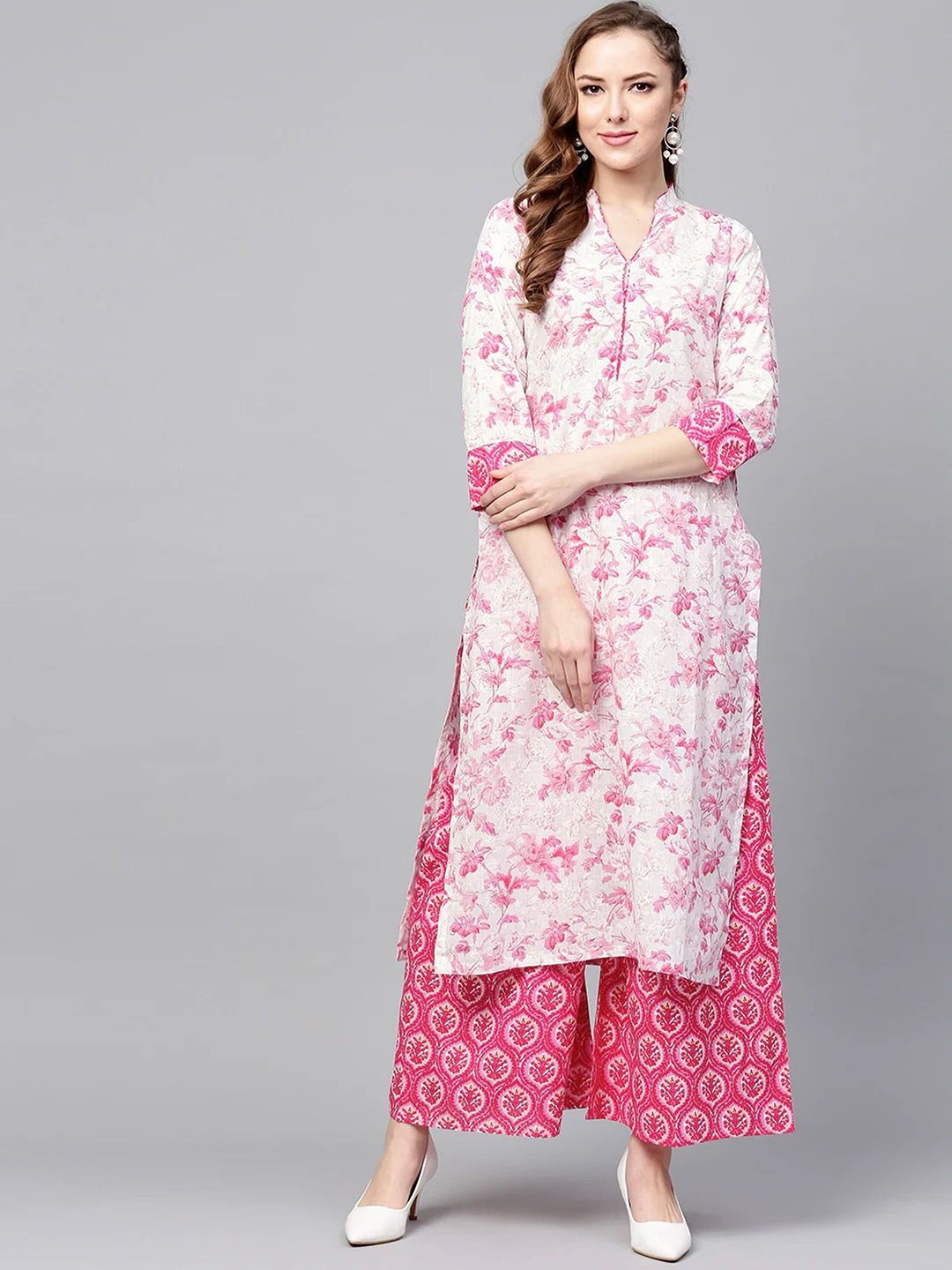 

AARYAHI Women Pink Floral Printed Regular Kurti with Palazzos