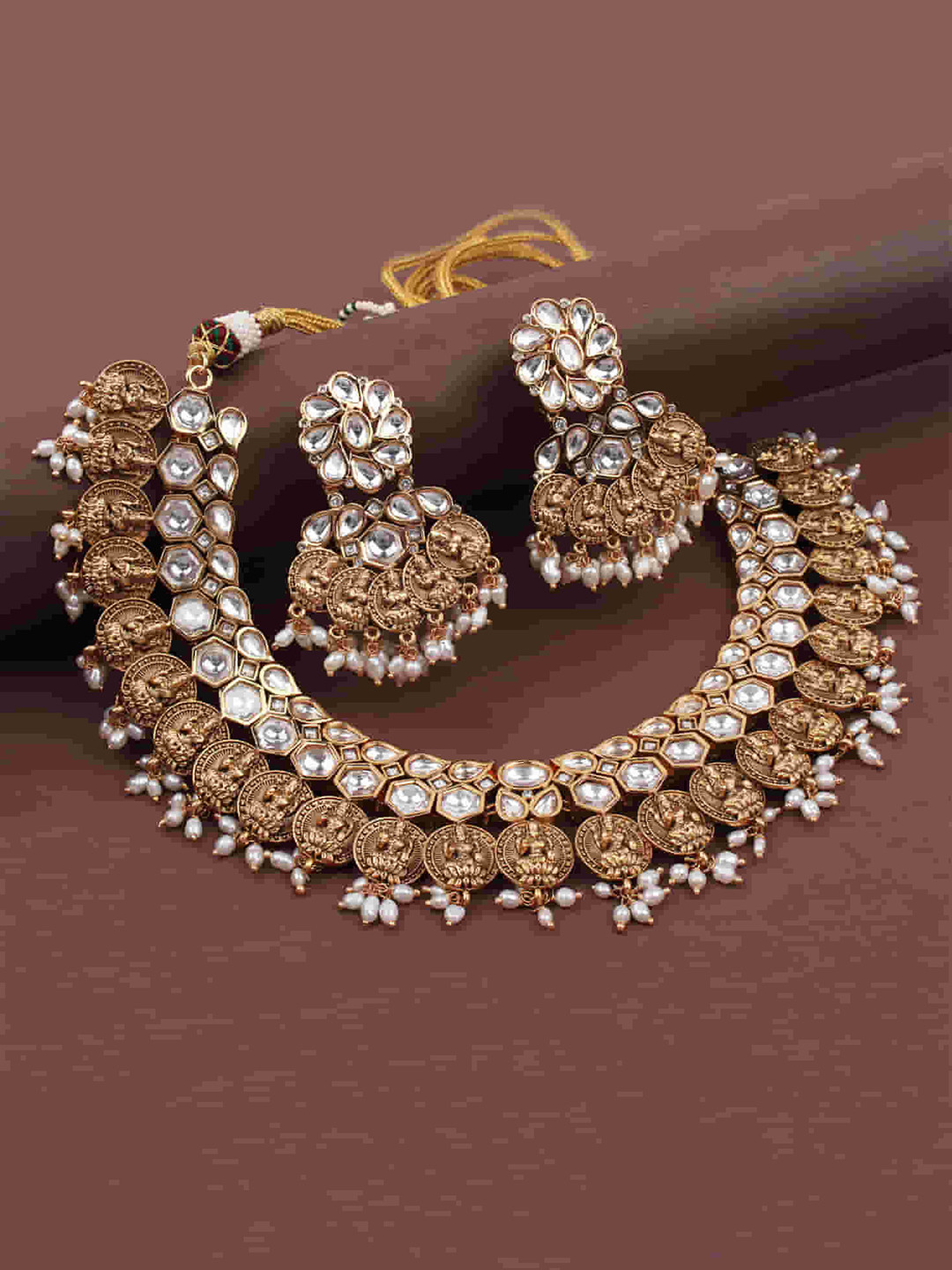 

Mirana Gold Plated Kundan Studded Jewellery Set