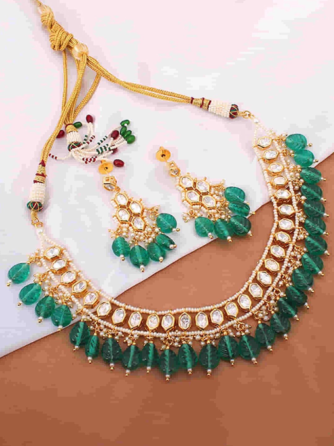 

Mirana Gold-Plated Kundan Stone Studded Jewellery Set