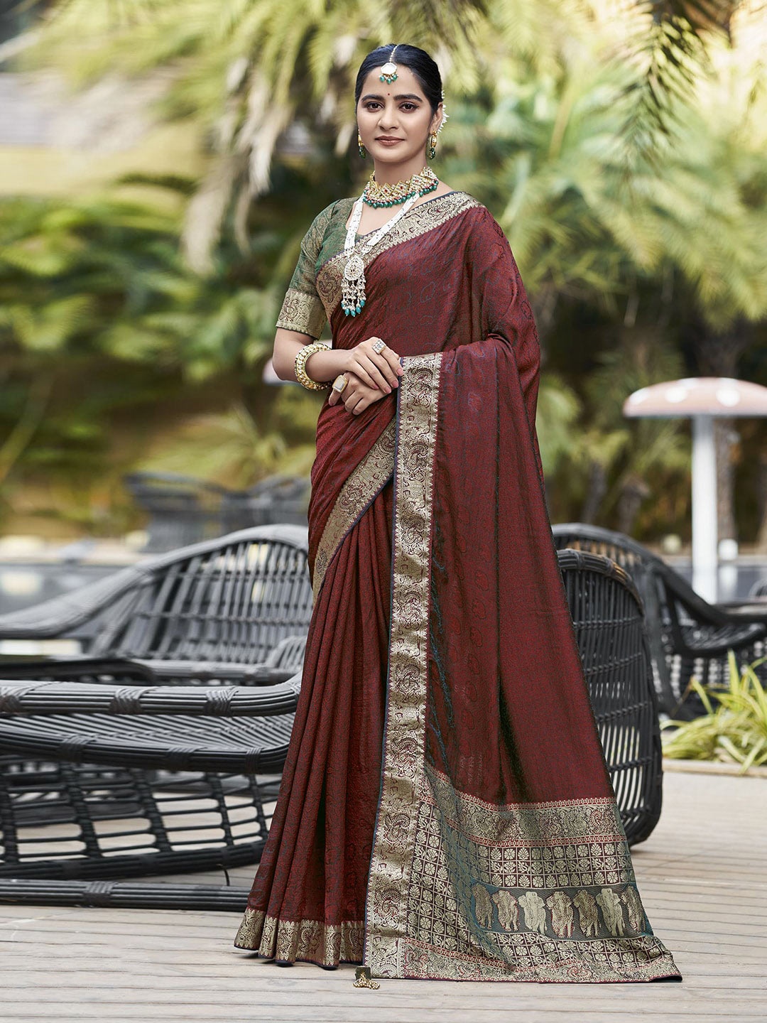 

Mitera Maroon Ethnic Motifs Printed Zari Art Silk Saree