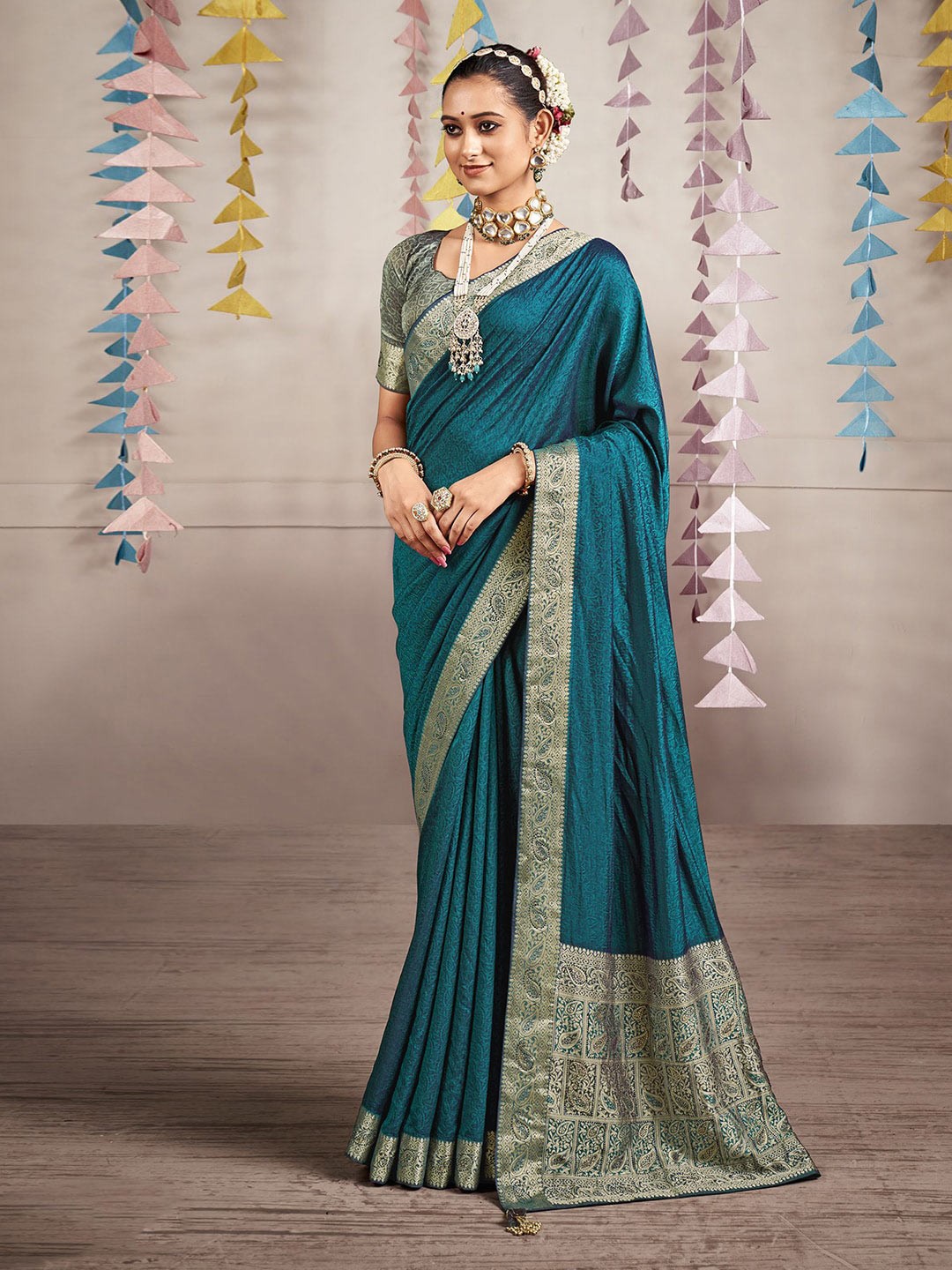 

Mitera Teal Ethnic Motifs Printed Zari Art Silk Saree