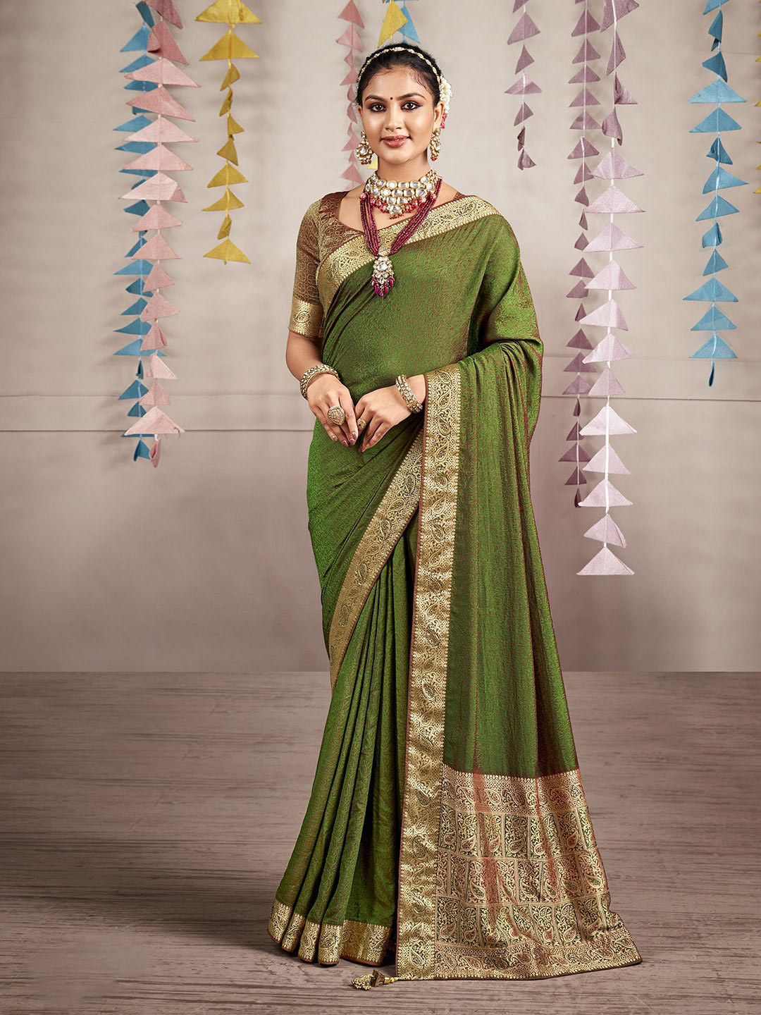 

Mitera Green Ethnic Motifs Woven Design Zari Art Silk Saree