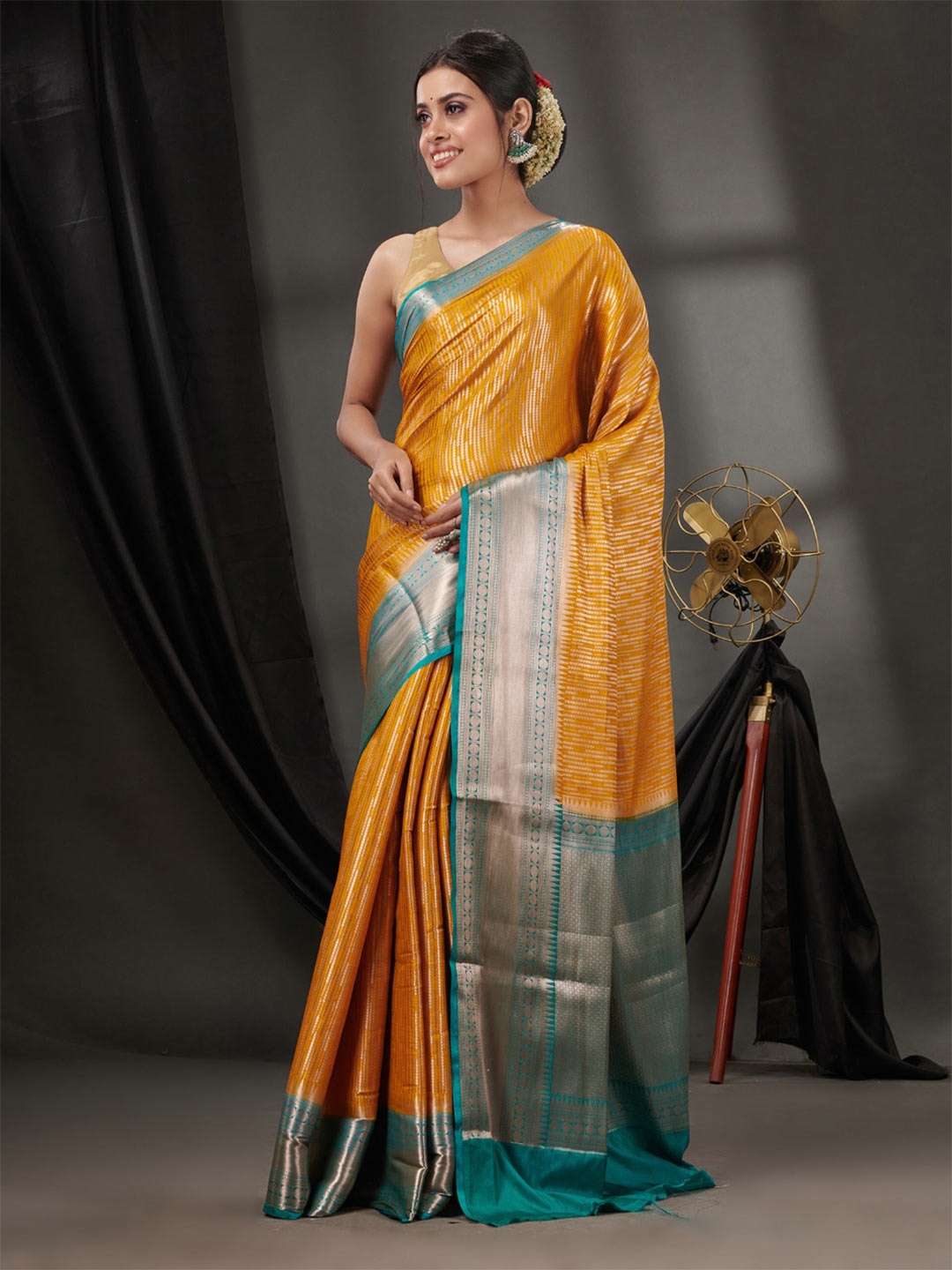 

Charukriti Ethnic Motifs Woven Design Zari Saree, Mustard