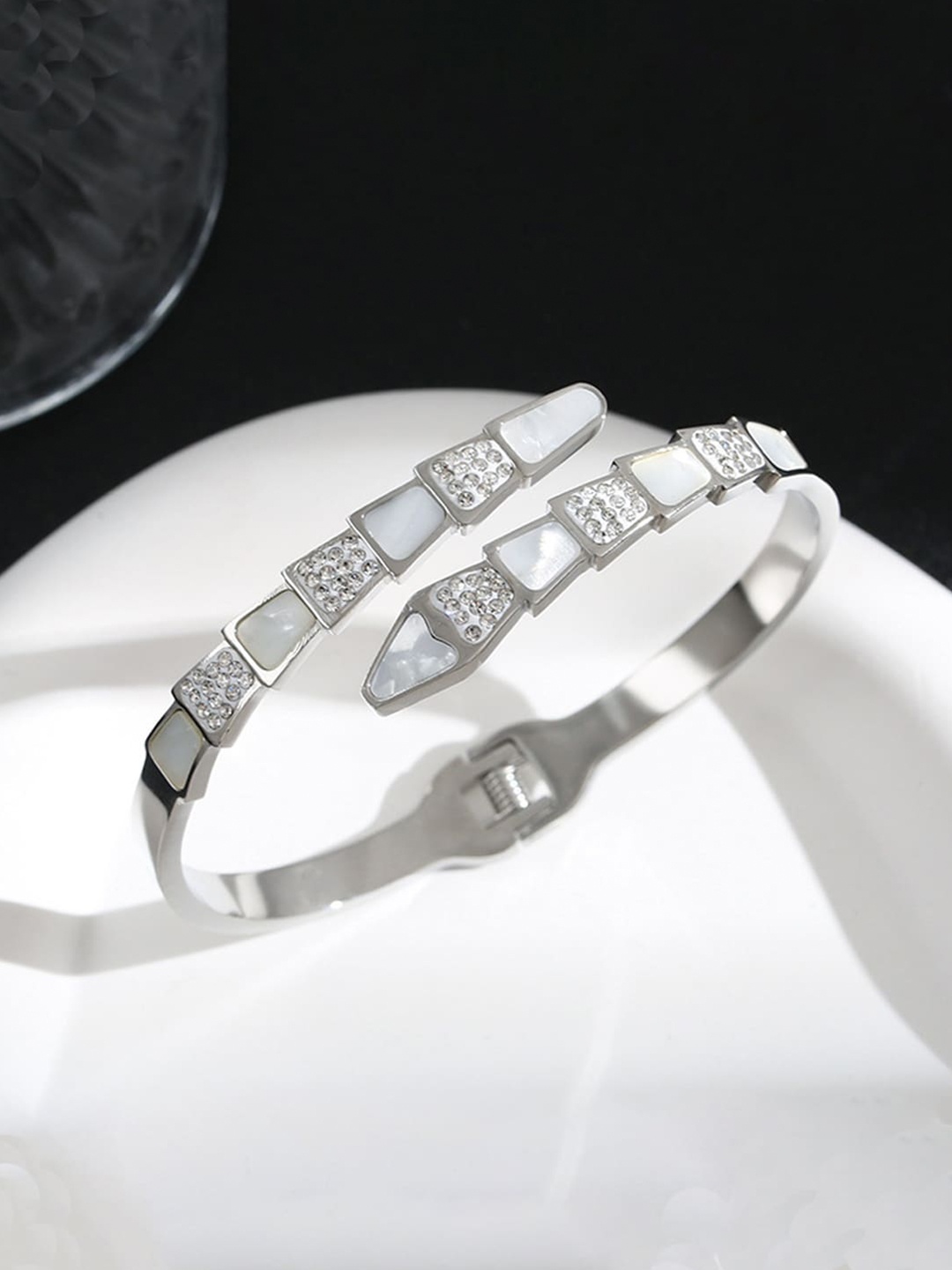 

Jewels Galaxy Stainless Steel Silver-Plated Bangle-Style AD Studded Bracelet