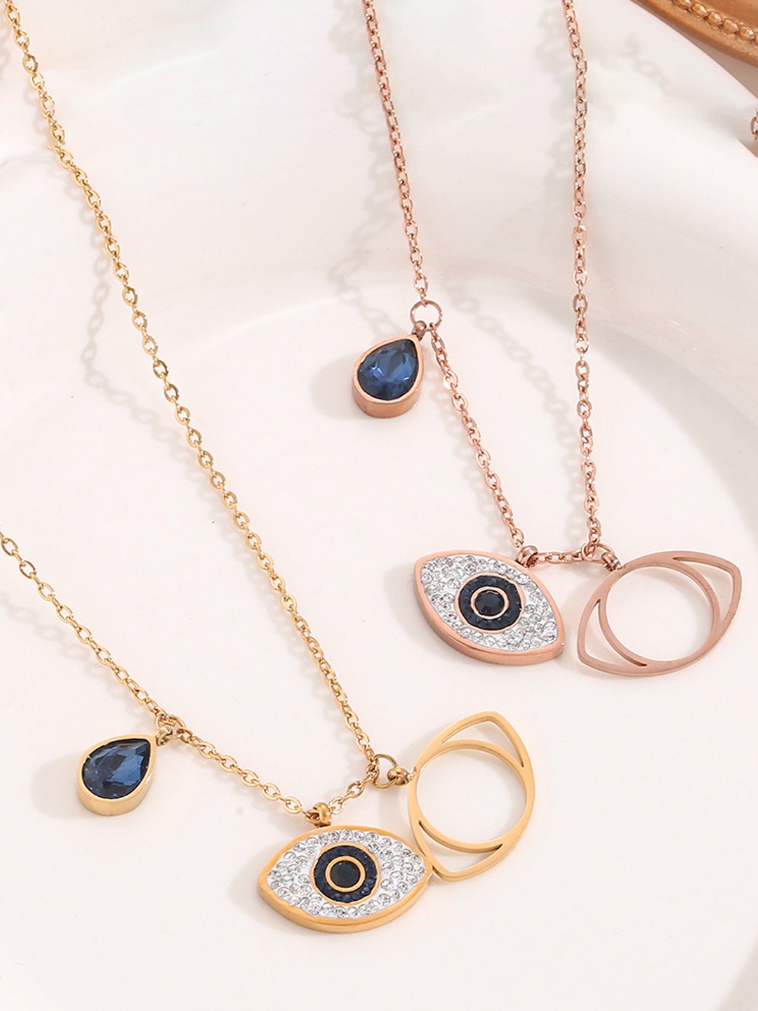 

Designs & You Set Of 2 Gold-Plated & Rose Gold-Plated AD-studded Evil Eye Pendants & Chain