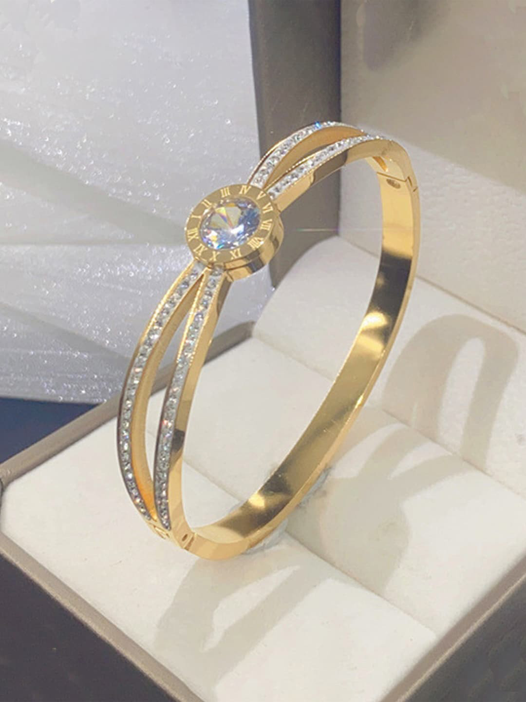 

Designs & You Women Gold-Toned & White American Diamond Gold-Plated Bangle-Style Bracelet