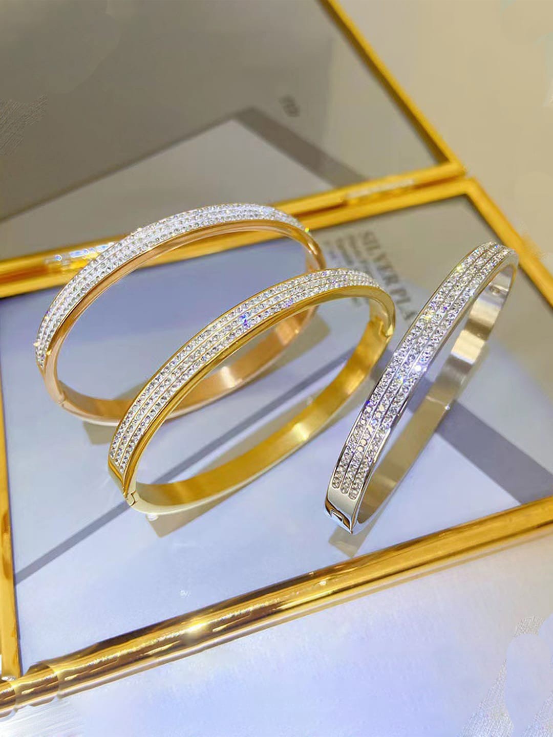 

Designs & You Set Of 3 Gold, Rose Gold & Silver Plated AD Studded Bangle-Style Bracelet