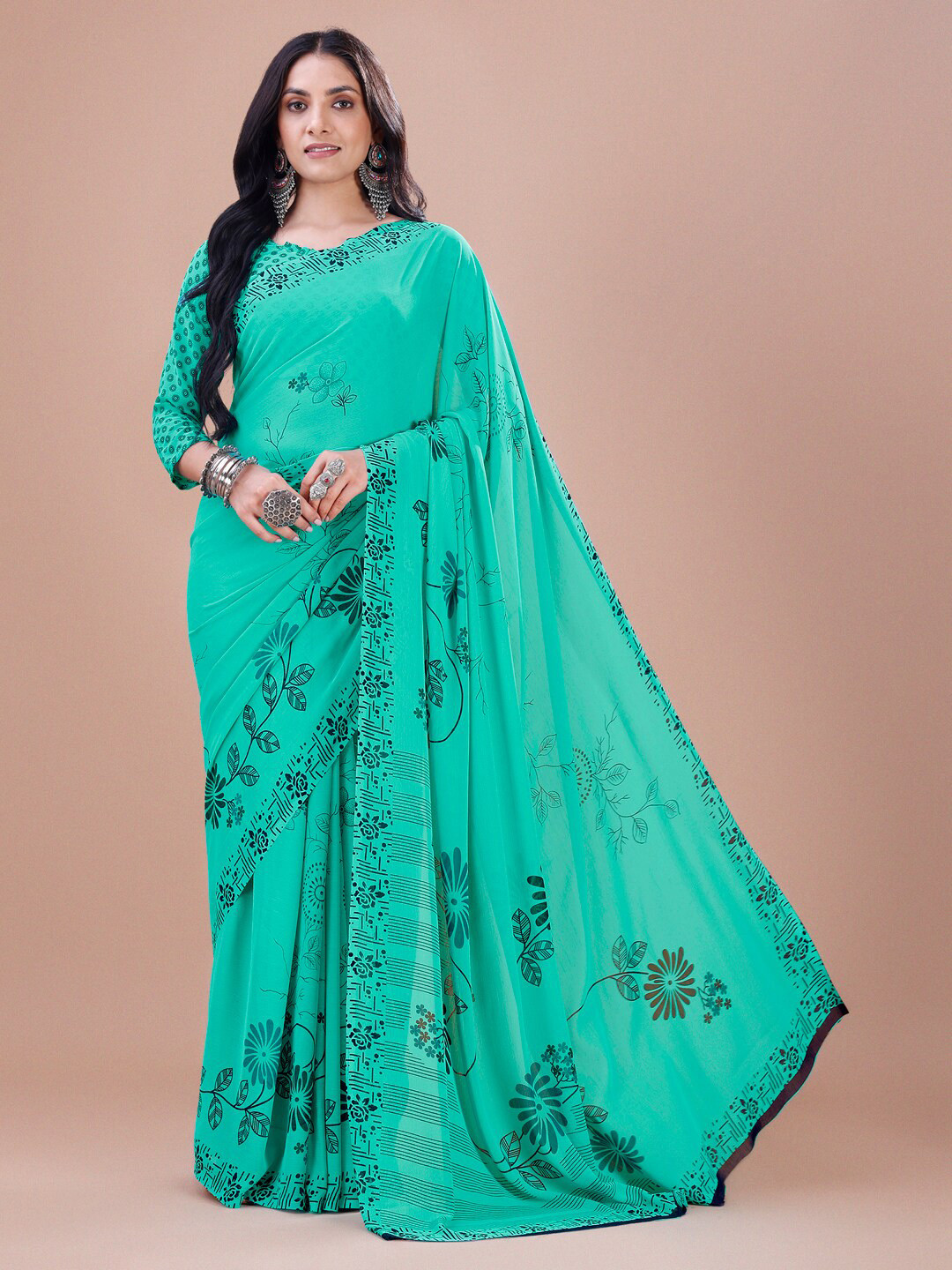 

Dori Turquoise Blue Floral Pure Georgette Saree