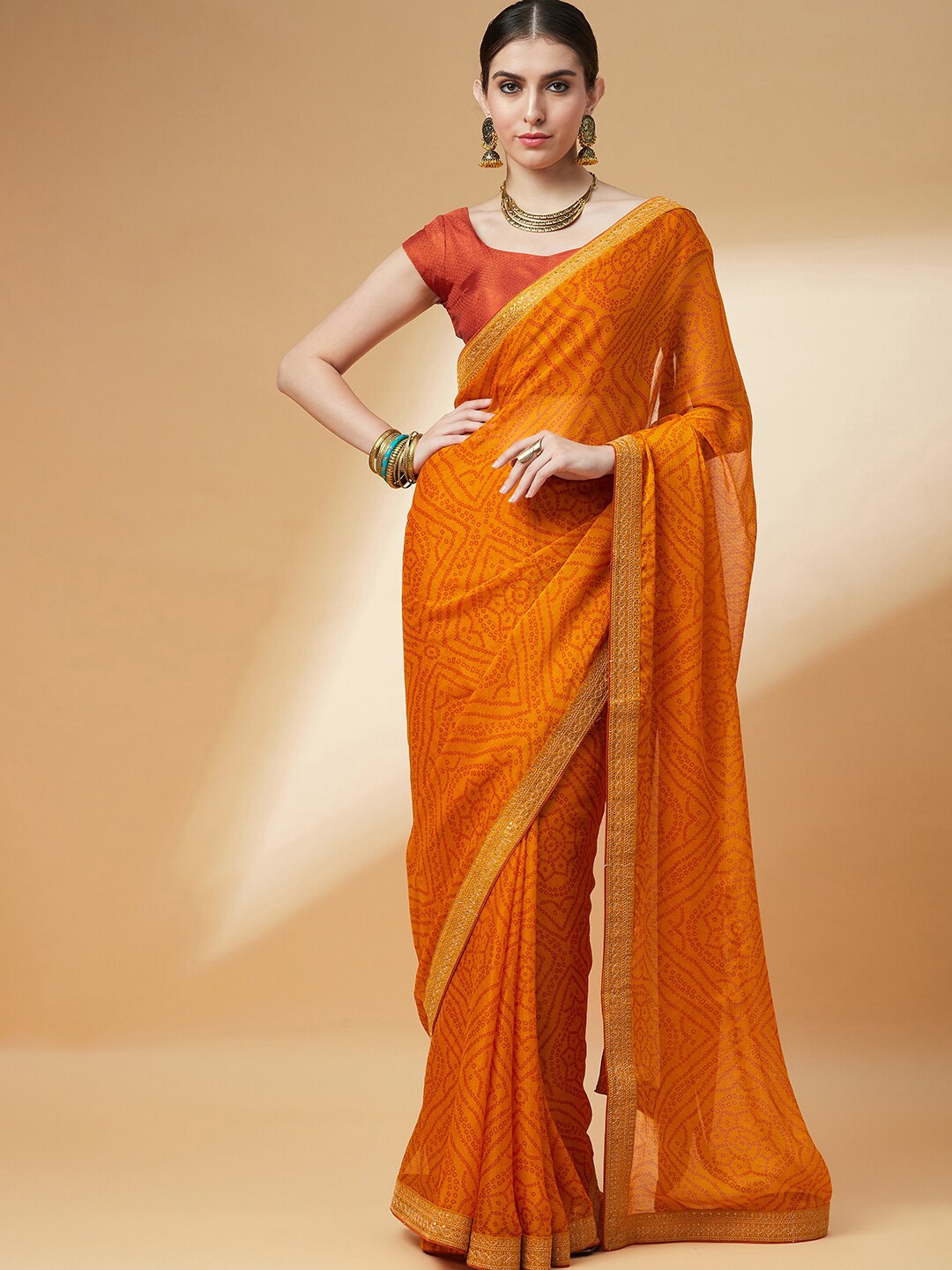 

Anouk Mustard & Orange Bandhani Printed Sequinned Bandhani Saree