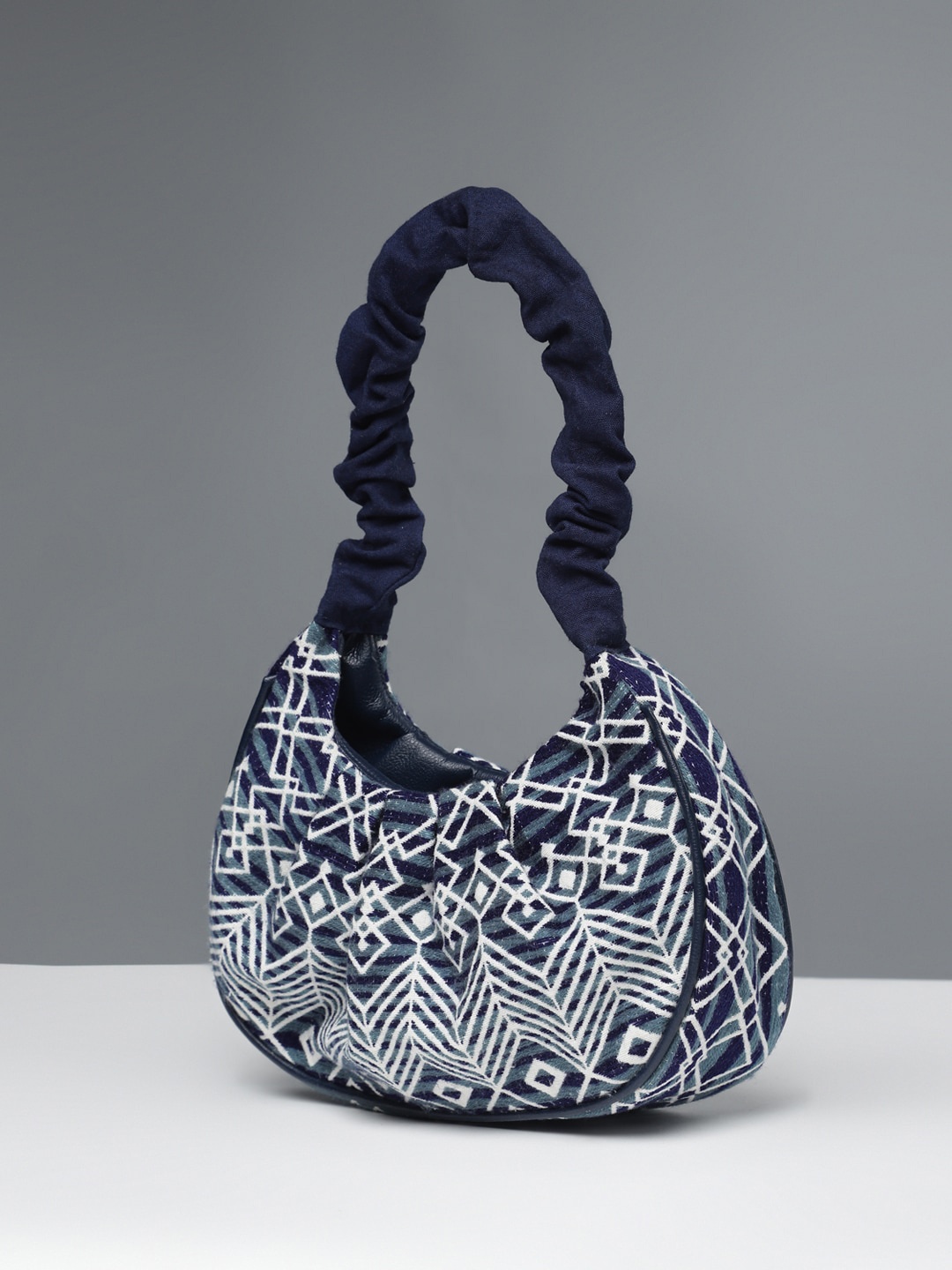 

DEEBACO Ethnic Motifs Printed Structured Hobo Bag, Navy blue