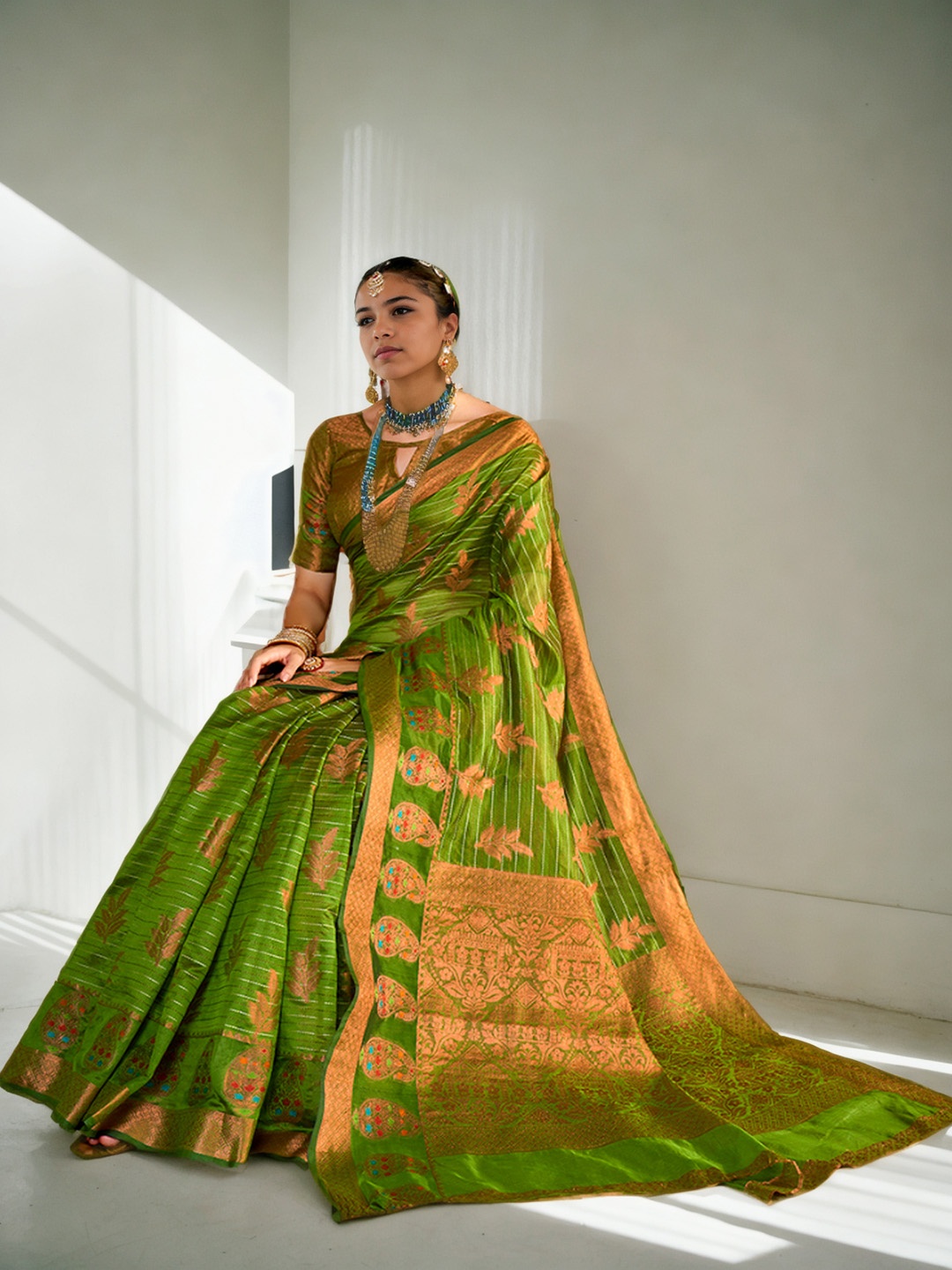 

Anouk Green Ethnic Motifs Woven Design Zari Organza Saree