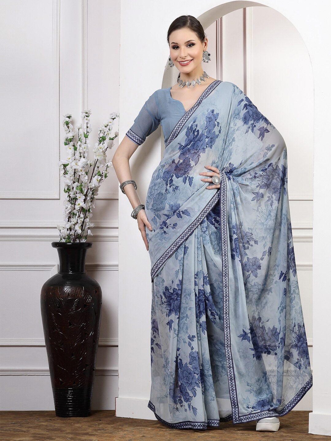 

Satrani Turquoise Blue Floral Poly Georgette Saree
